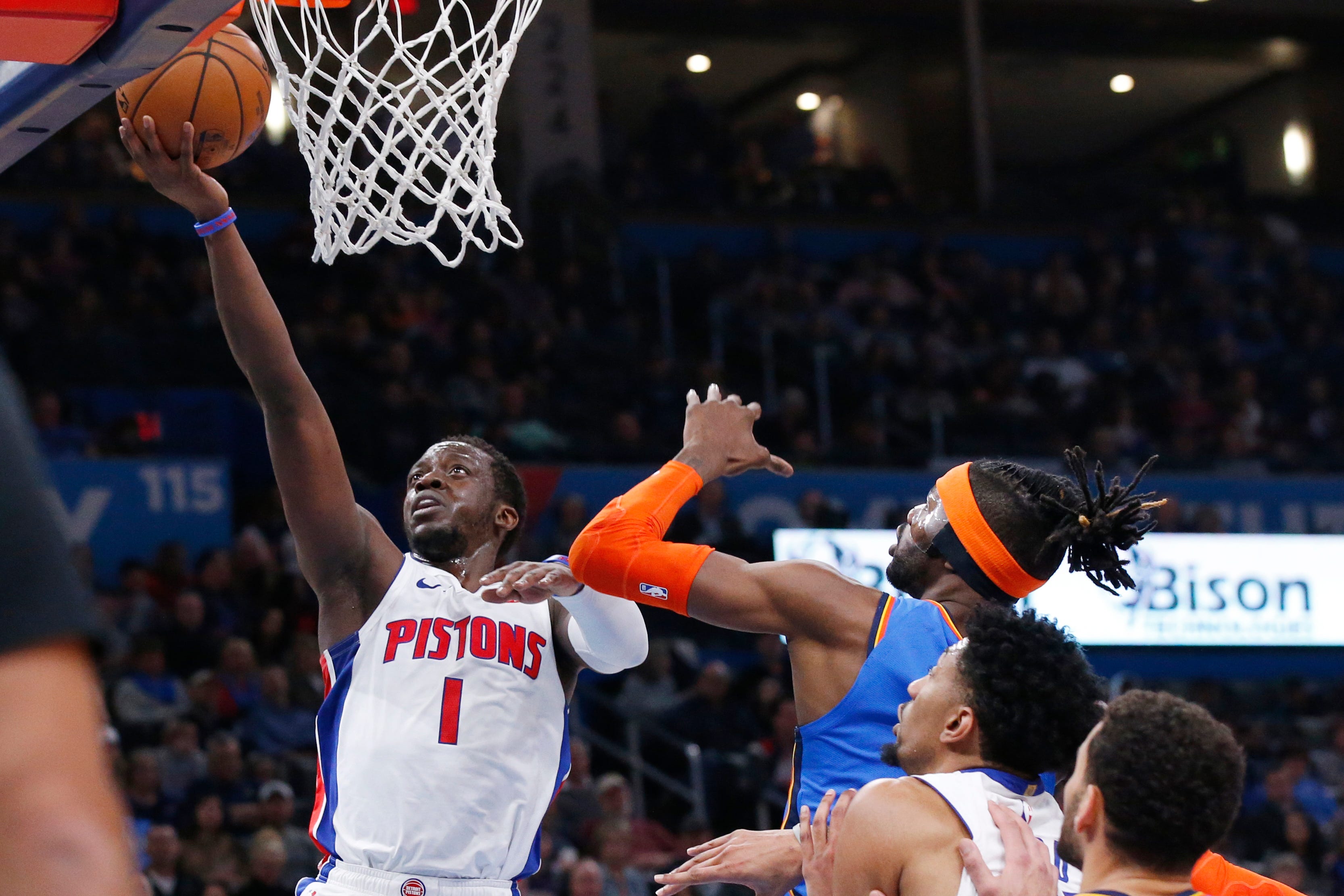 Pistons guard Reggie Jackson (1) shoots in front of Oklahoma City Thunder center Nerlens Noel, right, during Friday's game.
