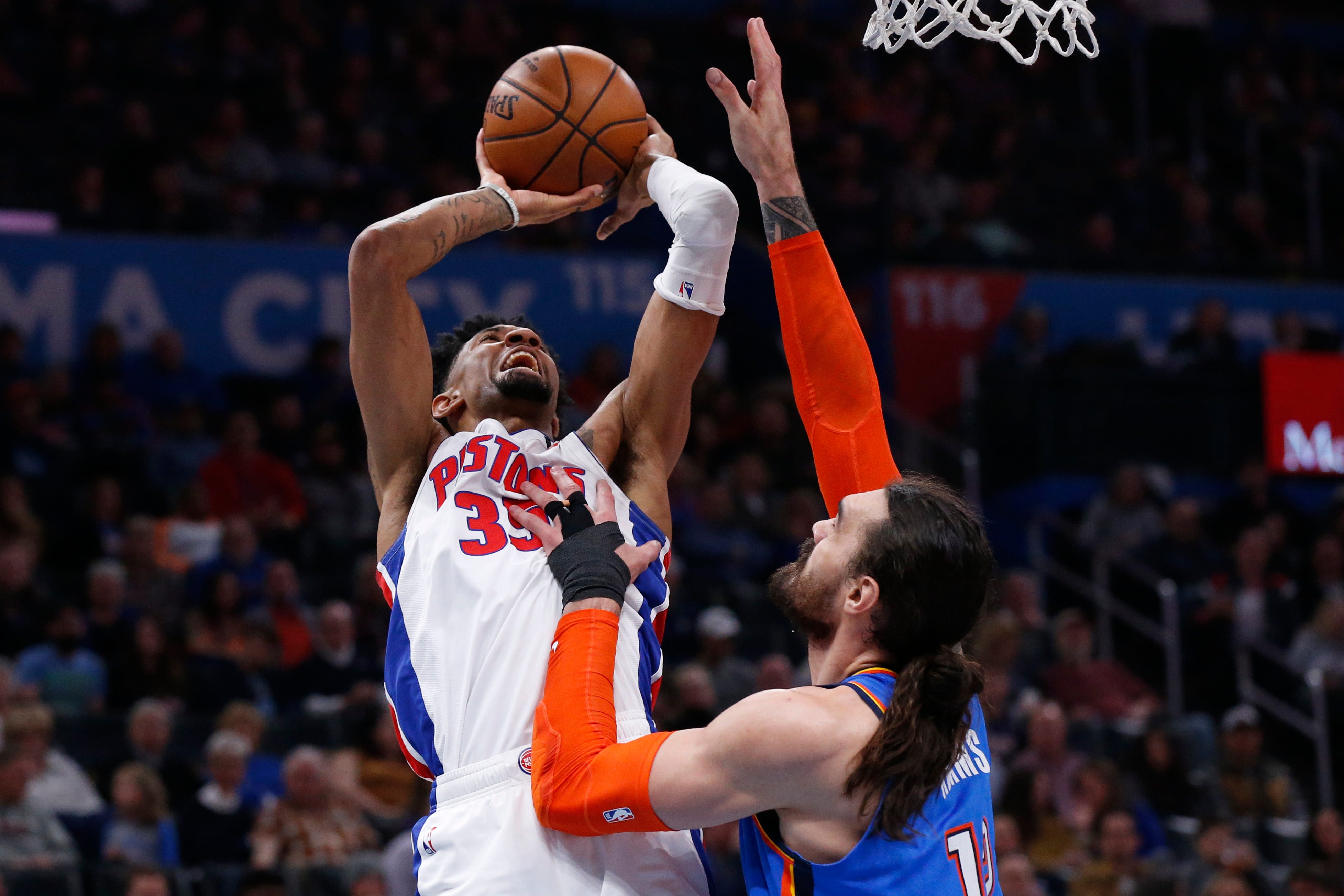 Detroit Pistons forward Christian Wood (35) shoots as Oklahoma City Thunder center Steven Adams defends during the first half.