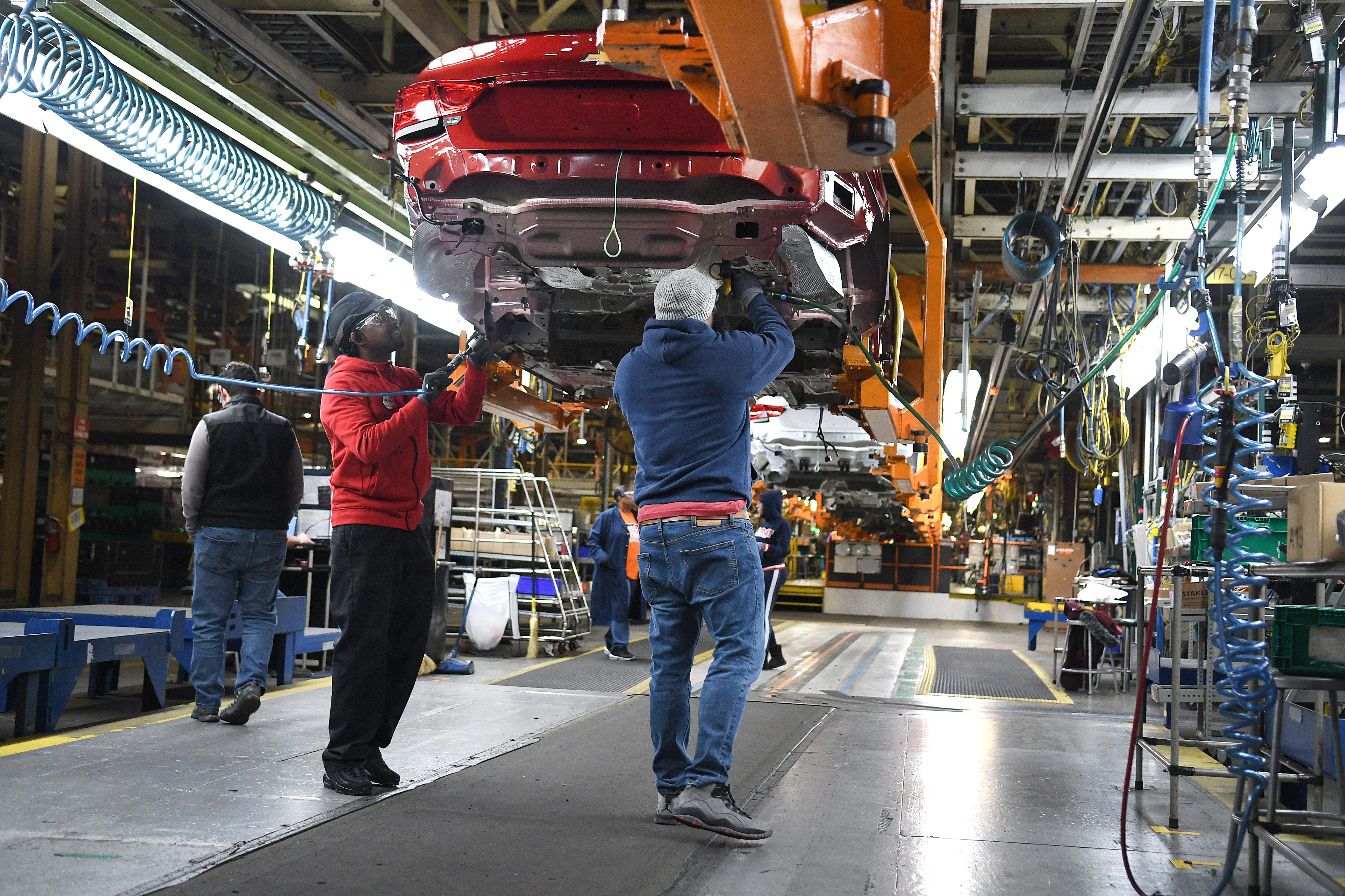 Assembly line workers at the General Motors Detroit-Hamtramck plant continue working on the Chevrolet Impala on Wednesday, February 12, 2020 as the plant will be converting from internal-combustion production to EV.