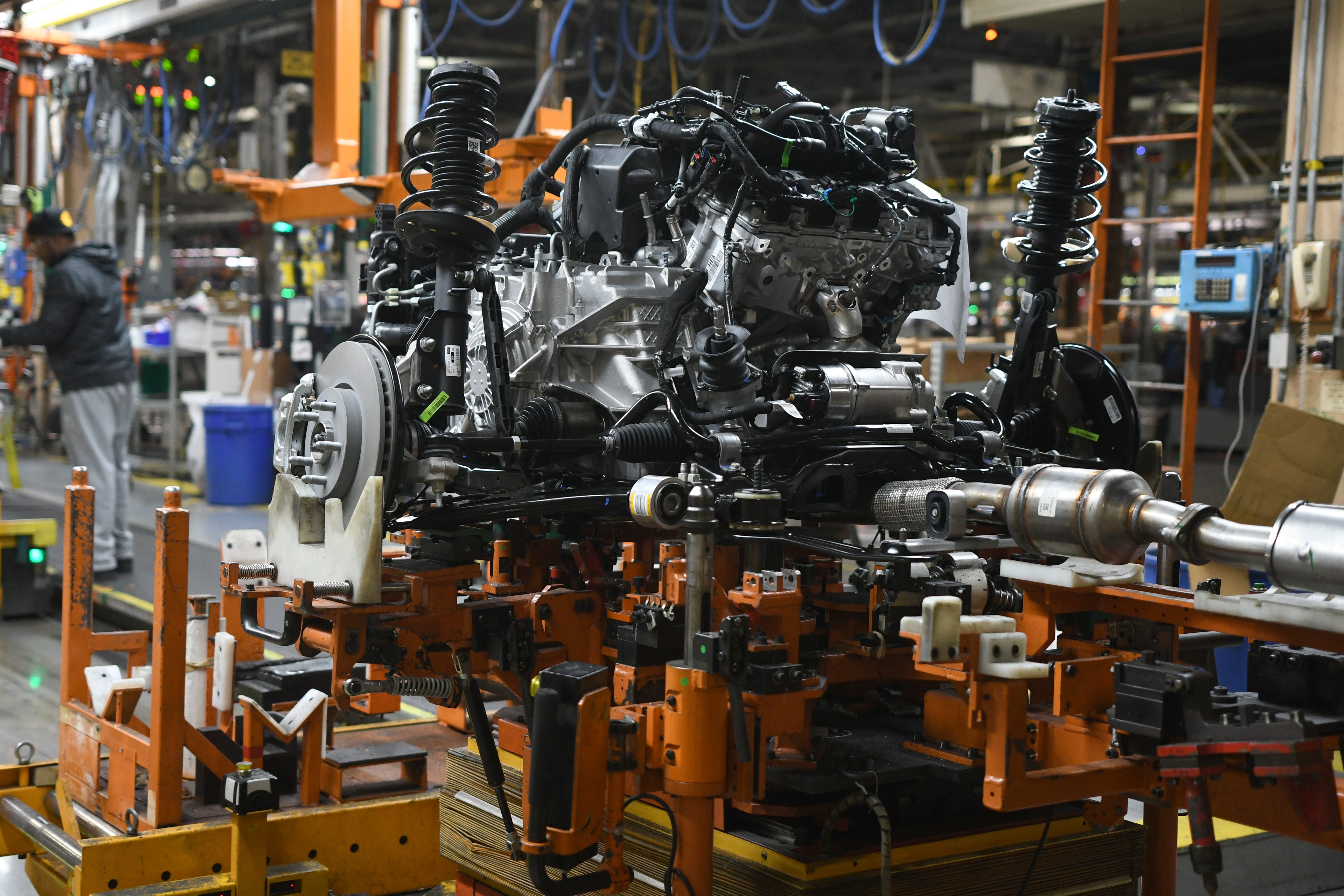 An engine sits at general assembly at General Motors Detroit-Hamtramck plant .