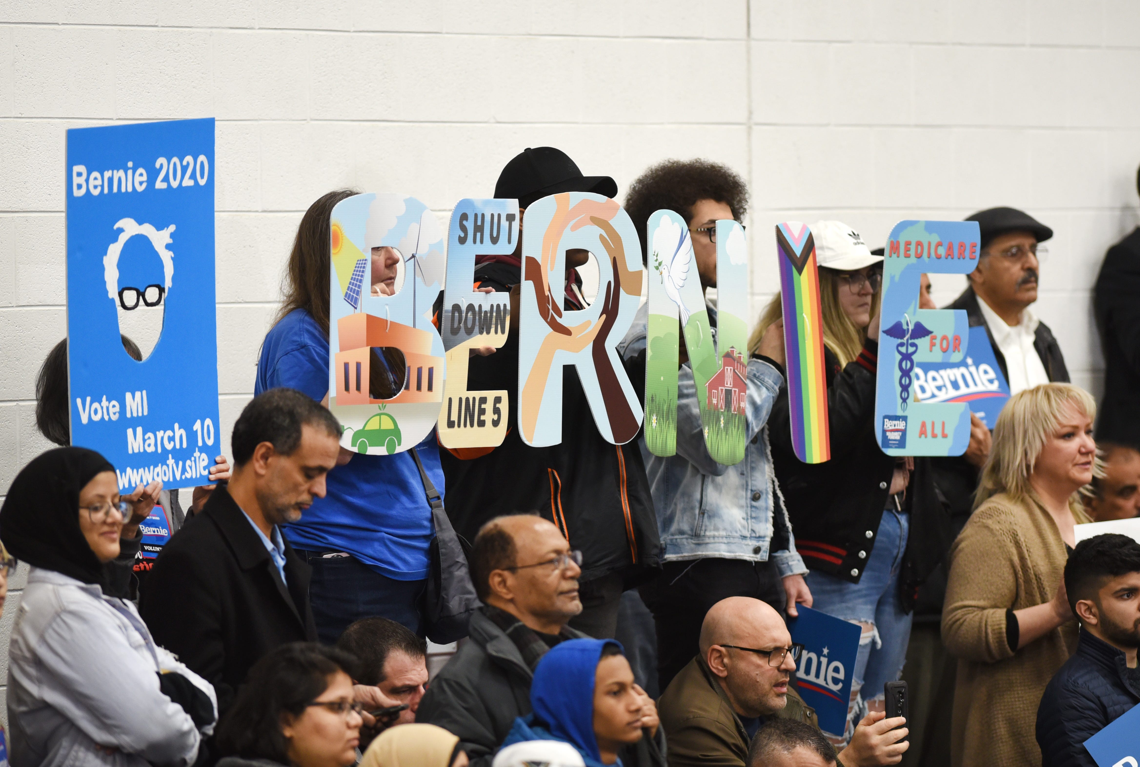 Supporters hold "Bernie" letters for his campaign stop at Salina Intermediate School in Dearborn.