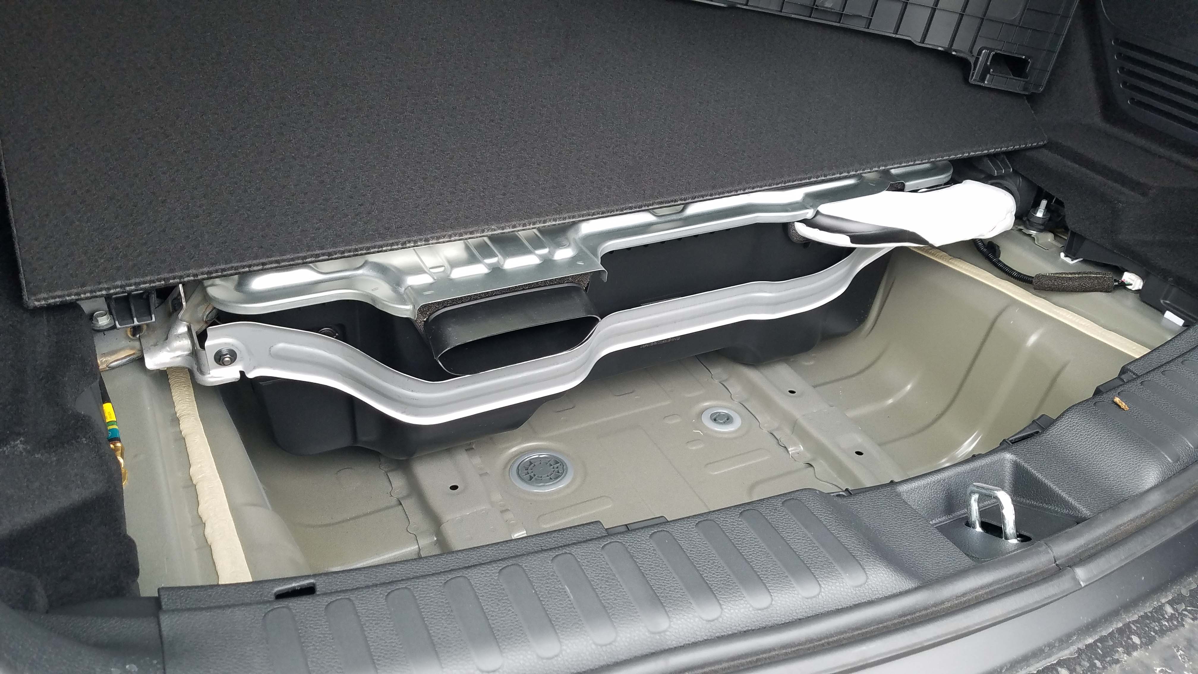 The 1.4 kWh battery for the 2020 Honda CR-V Hybrid is stored under the rear cargo area — taking up space where a spare tire would normally be.