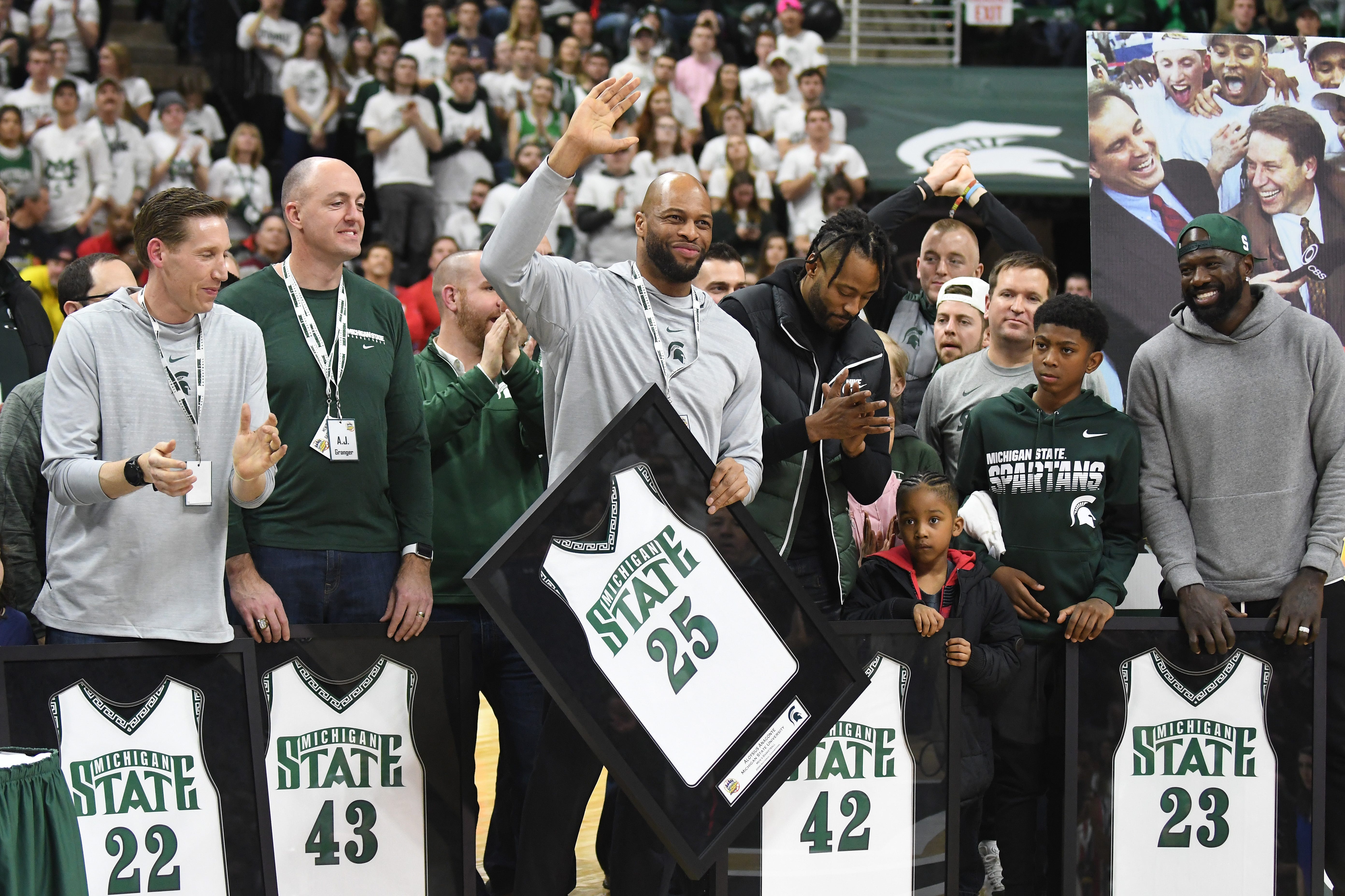 Michigan State ' s 2000 championship team member Aloyisus Anagonye is introduced, standing next to Steve Cherry, A. J. Granger, Morris Peterson and Jason Richardson, during a halftime ceremony this past season.
