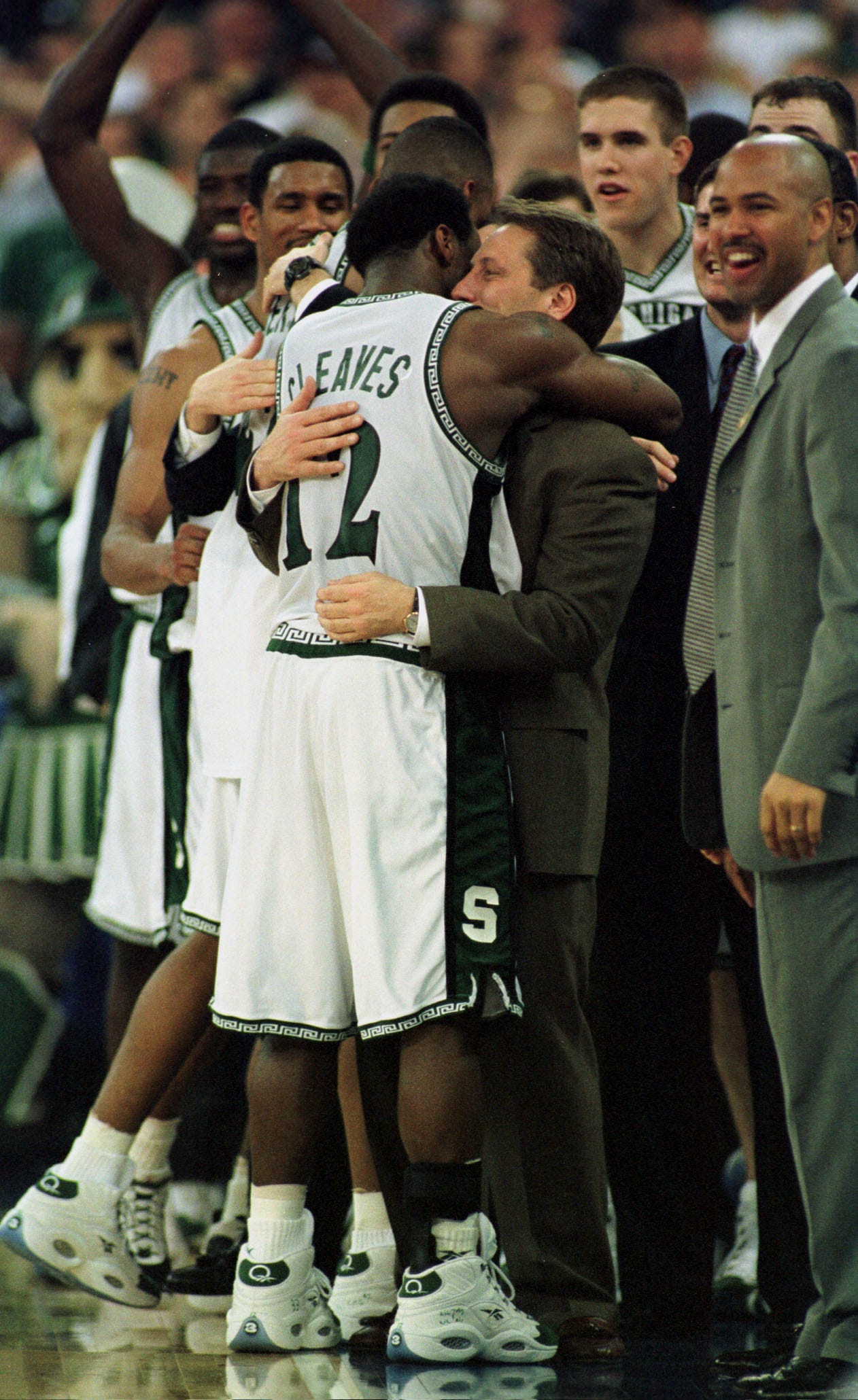 Michigan State ' s Mateen Cleaves is congratulated by head coach Tom Izzo.