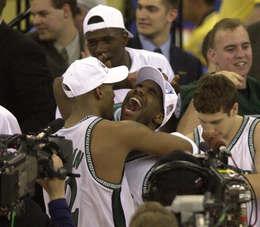 Mateen Cleaves embraces Morris Peterson, left, after winning the 2000 NCAA national championship game.