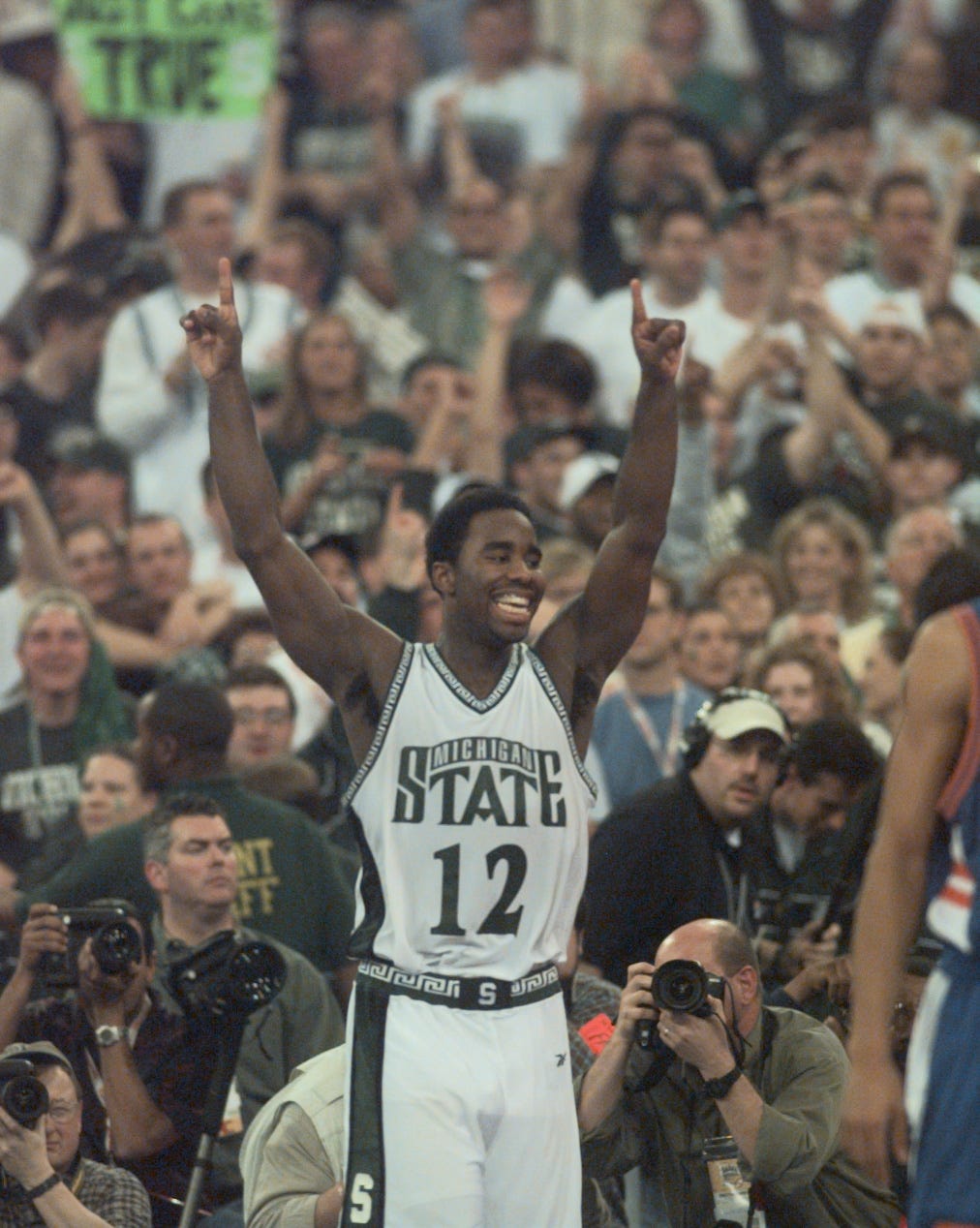 Mateen Cleaves celebrates as he comes off the floor near end of the game after Michigan State defeated Florida, 89-76, for the 2000 NCAA national championship.