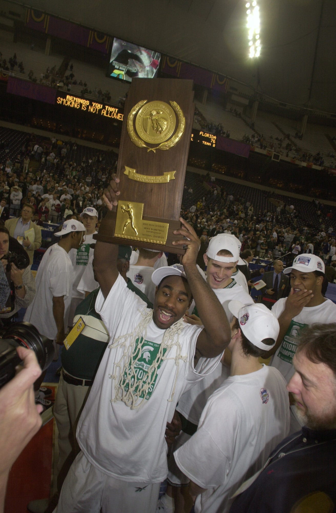 Mateen Cleaves holds the trophy after Michigan State won the 2000 NCAA national championship game.
