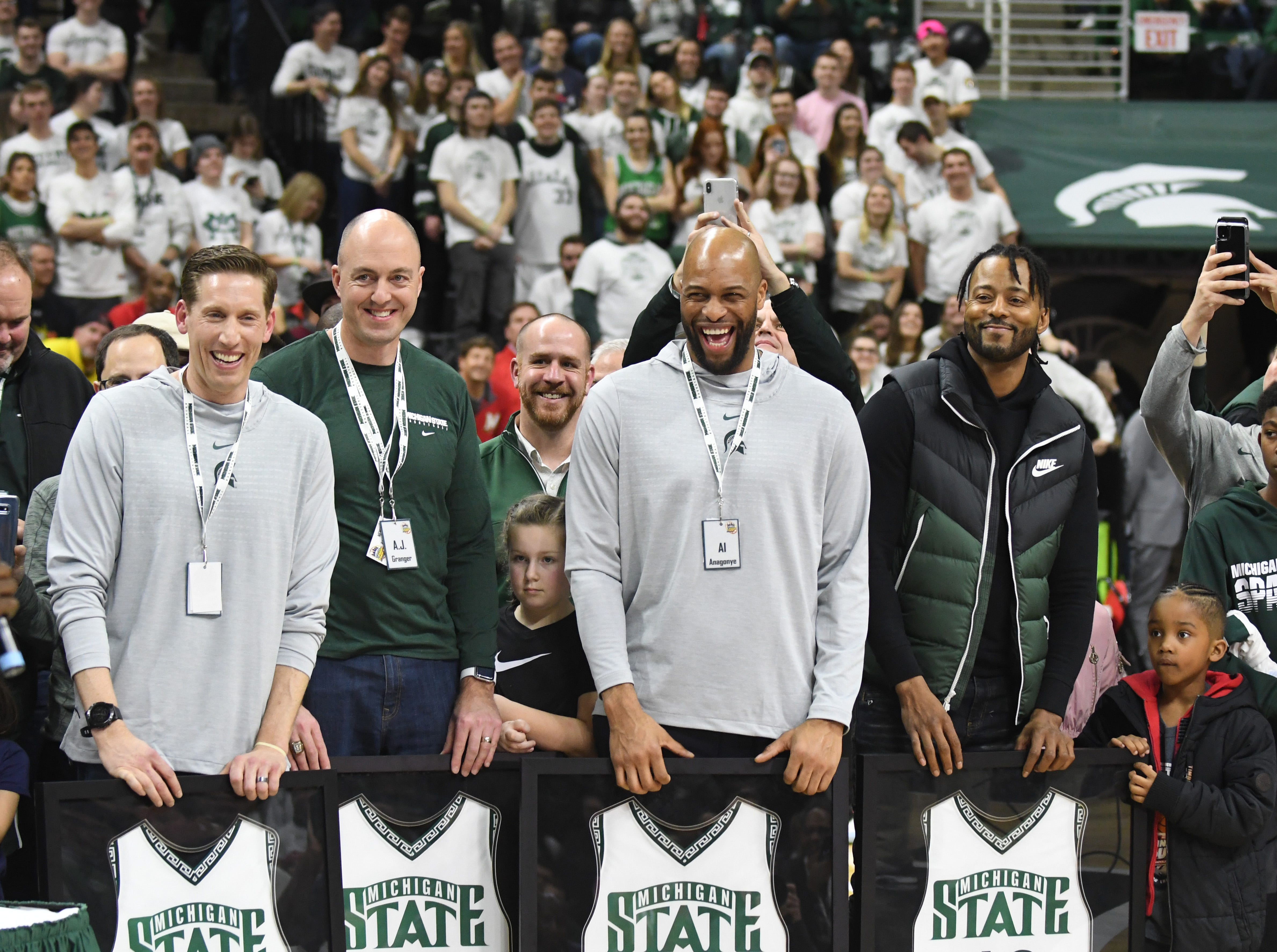 Michigan State ' s 2000 championship team members, from left, Steve Cherry, A. J. Granger, Aloyisus Anagonye and Morris Peterson were honored during a ceremony this past season at the Breslin Center.