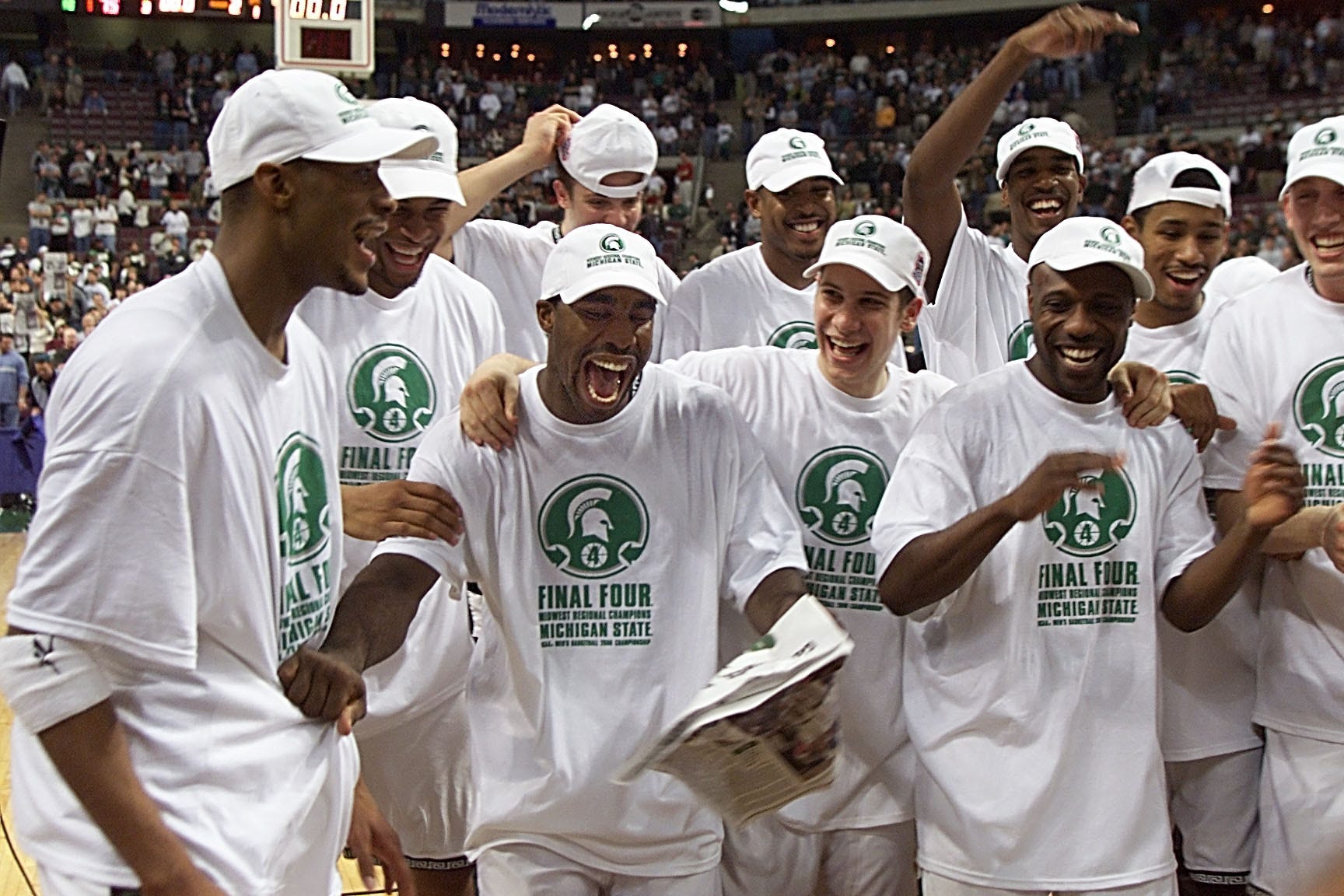 Michigan State ' s Mateen Cleaves celebrates with Morris Peterson, left, and teammates after defeating Iowa State, 75-64, in the Midwest Regional Final at The Palace of Auburn Hills. The Spartans advanced to the Final Four in Indianapolis with the win.
