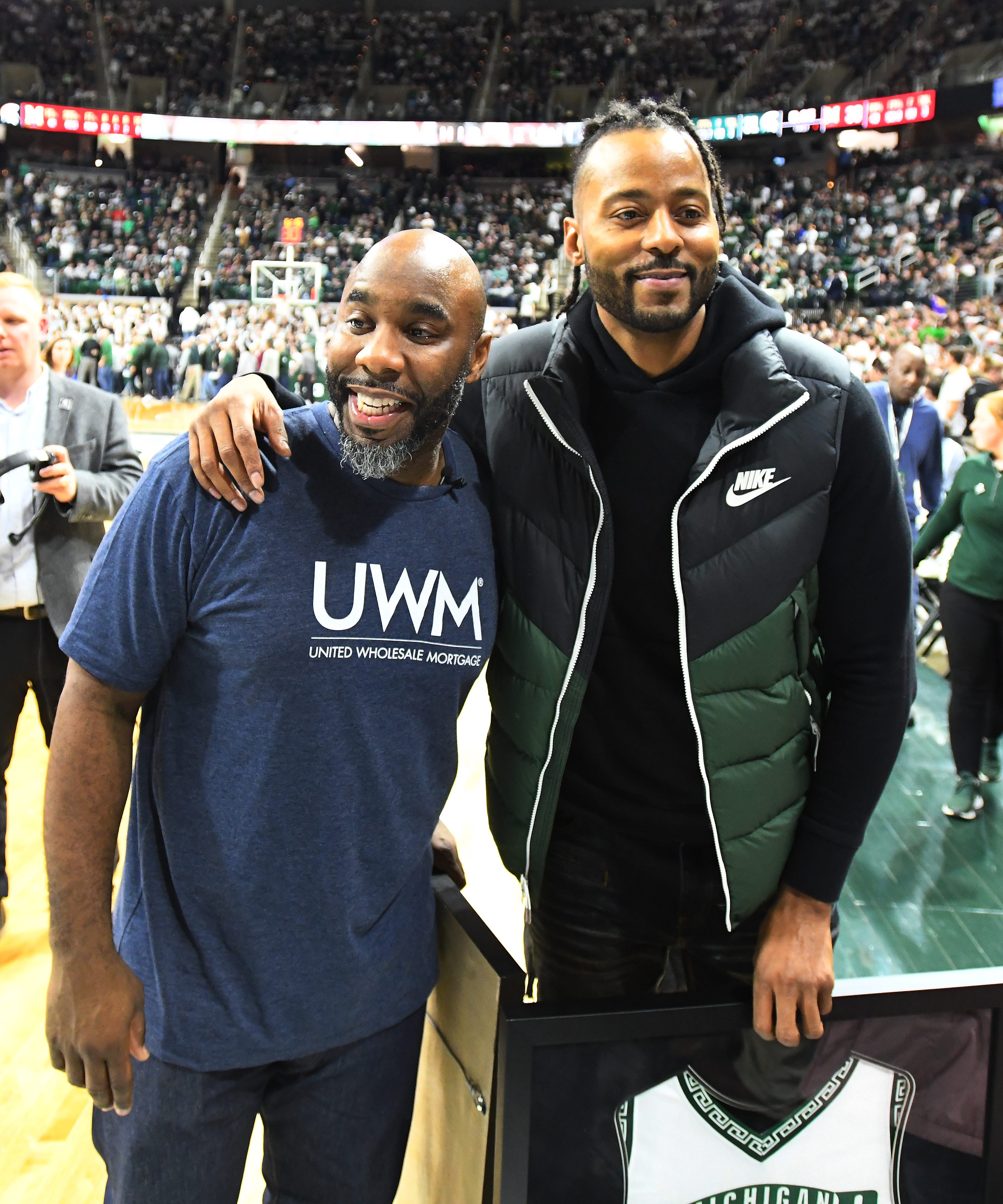 Michigan State ' s Mateen Cleaves and Morris Peterson leave the floor after a halftime ceremony honored the 2000 championship team this past season.