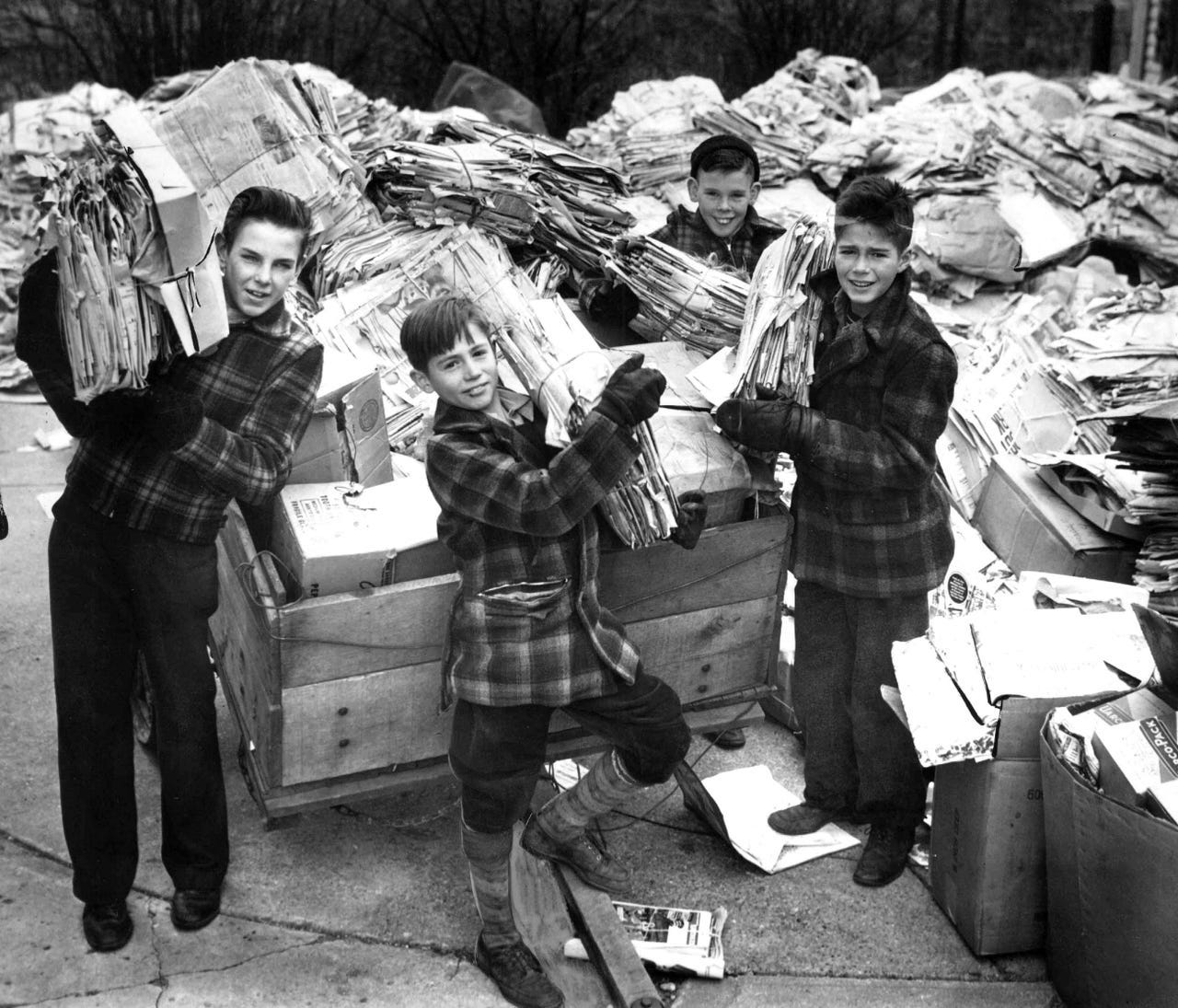During January 1944 a group of young men; Detroit's salvage effort continued throughout the war. Here, James Braill, John Dresbach, Tom Dresbacha and John Brazill collect paper to recycle in December 1944.