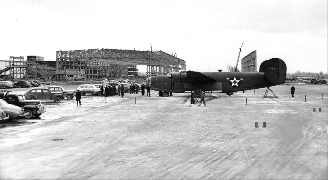 The first B24 Liberator bomber rolled off the assembly line on Oct. 1, 1942. Parts of the unfinished factory are visible behind the plane.