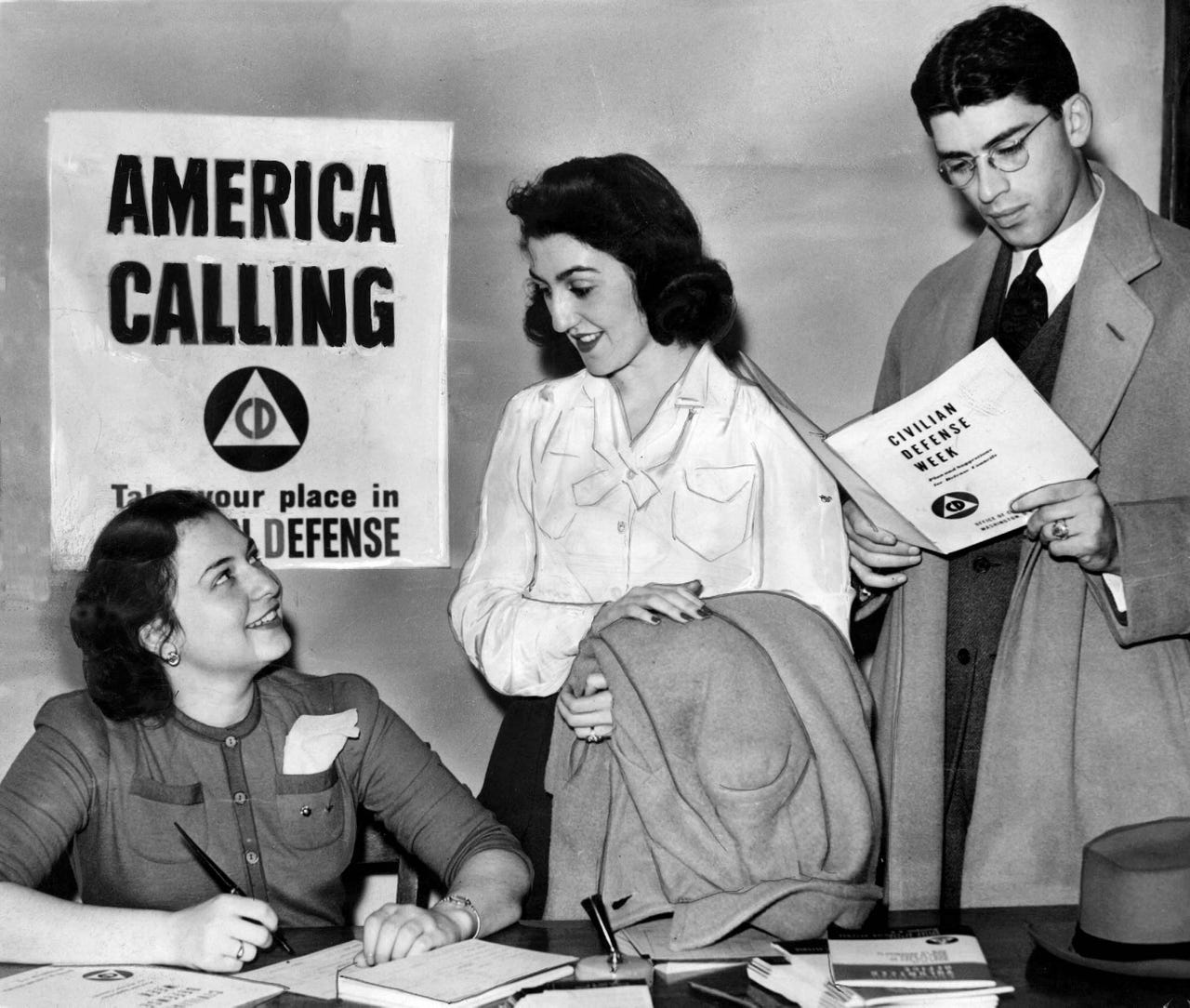 Georgette Rinaldi registers Jane Jacob and Bert Neidig for civilian defense during the fall of 1941.