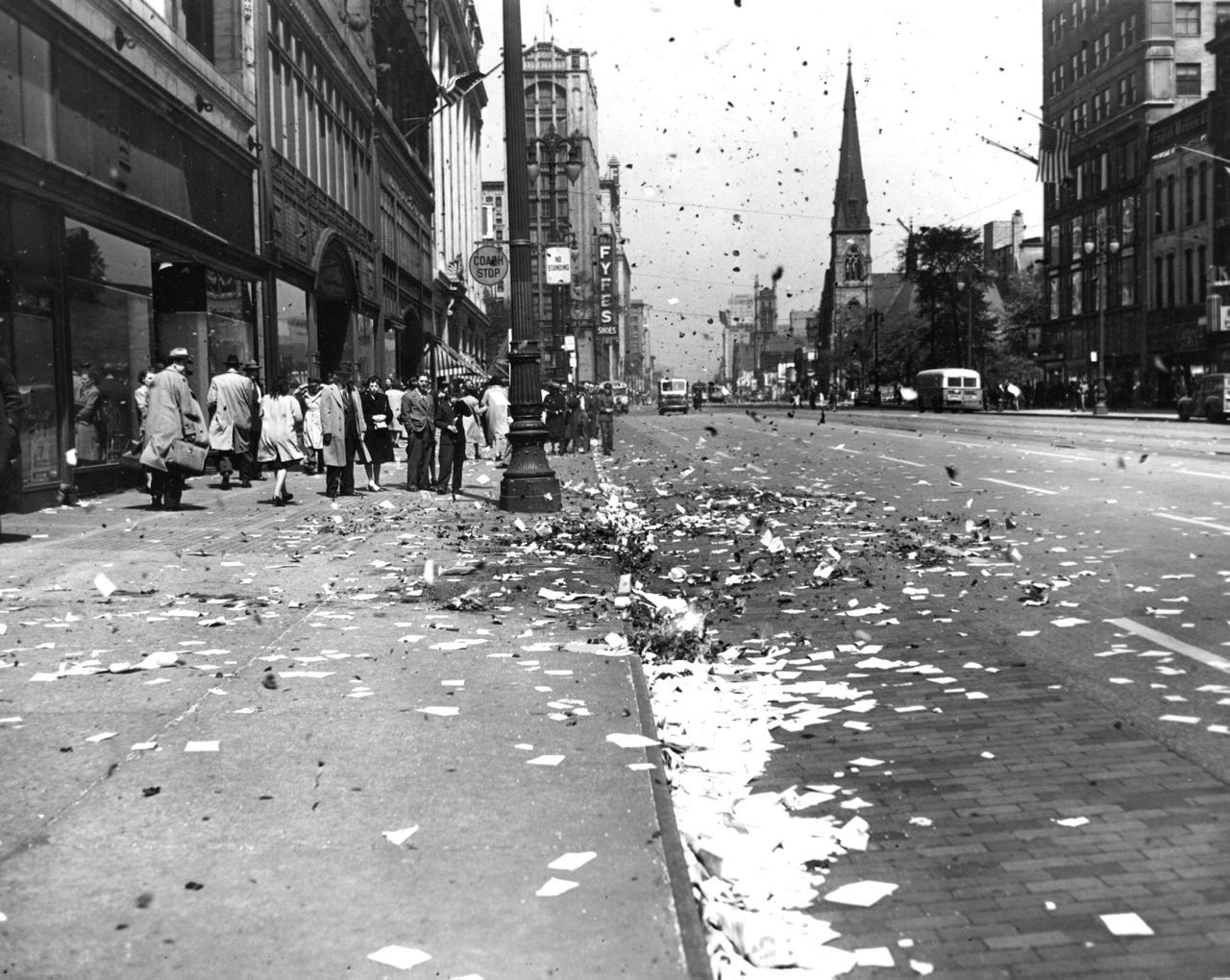 Paper burns on Woodward in front of Grinnell's Music store at Grand River after the celebrations for VE Day on May 8, 1945.