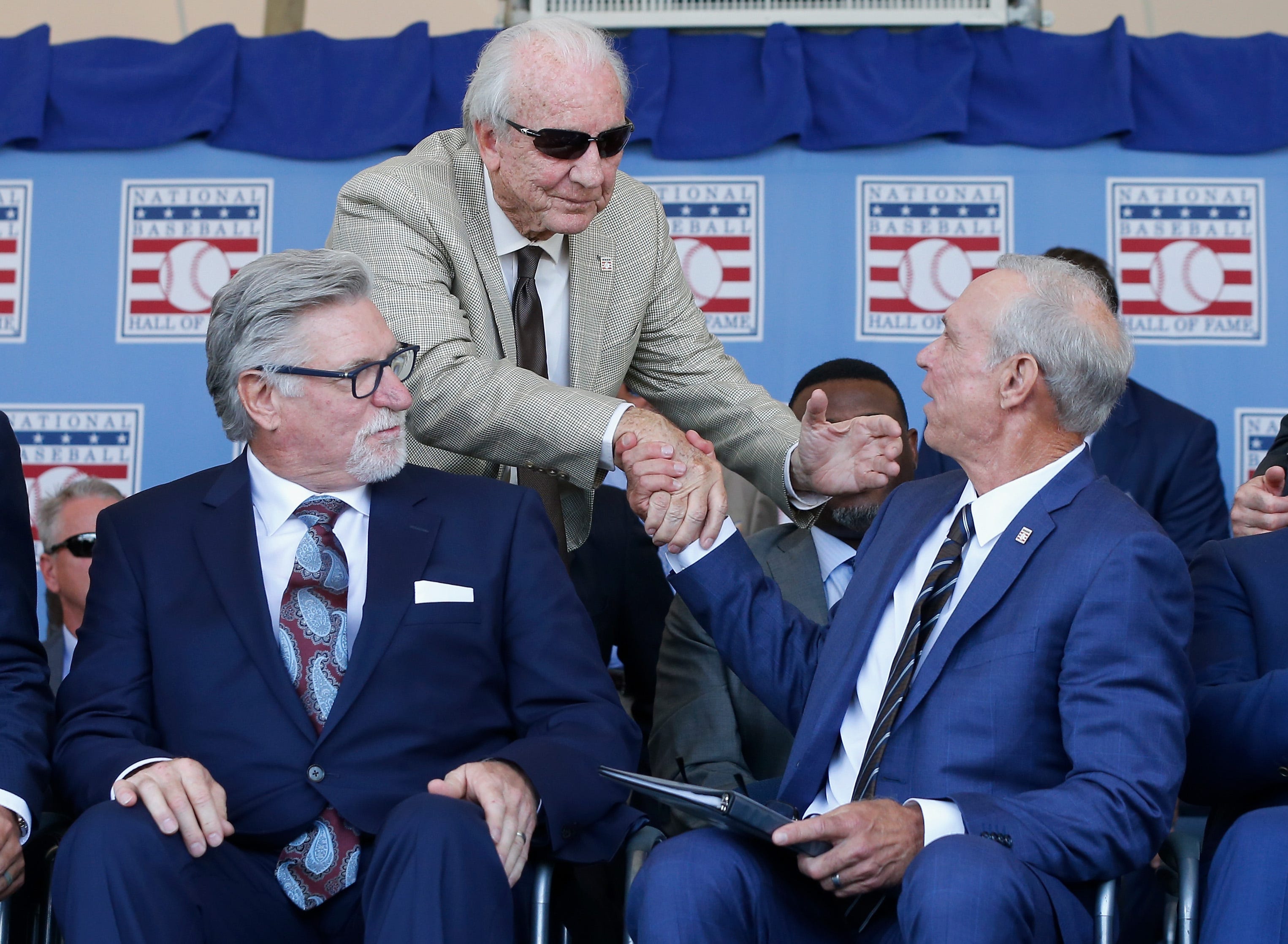 Hall of Famer Al Kaline congratulates inductee Alan Trammell after his speech as fellow inductee Jack Morris looks on at Clark Sports Center during the Baseball Hall of Fame induction ceremony on July 29, 2018 in Cooperstown, New York.
