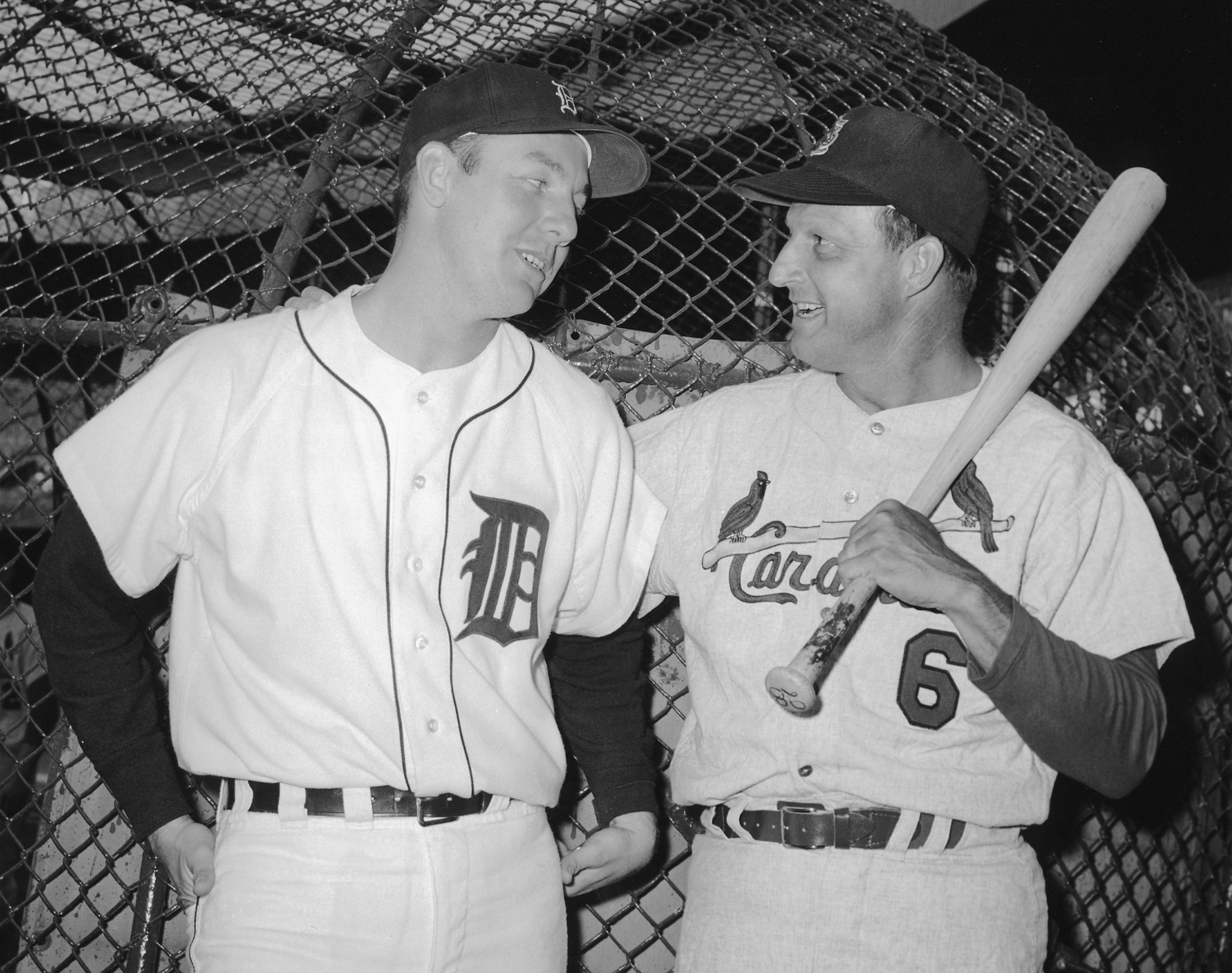 Al Kaline of the Tigers and former Cardinals great Stan Musial talk in the batting cage at Tiger Stadium before an exhibition game between the two teams. Musial, inducted into the Baseball Hall of Fame in 1969, had retired the year before but suited up for the love of the game. Four years later, Kaline would lead the Tigers to their first World Series victory in 23 seasons, batting .379 against those same St. Louis Cardinals.