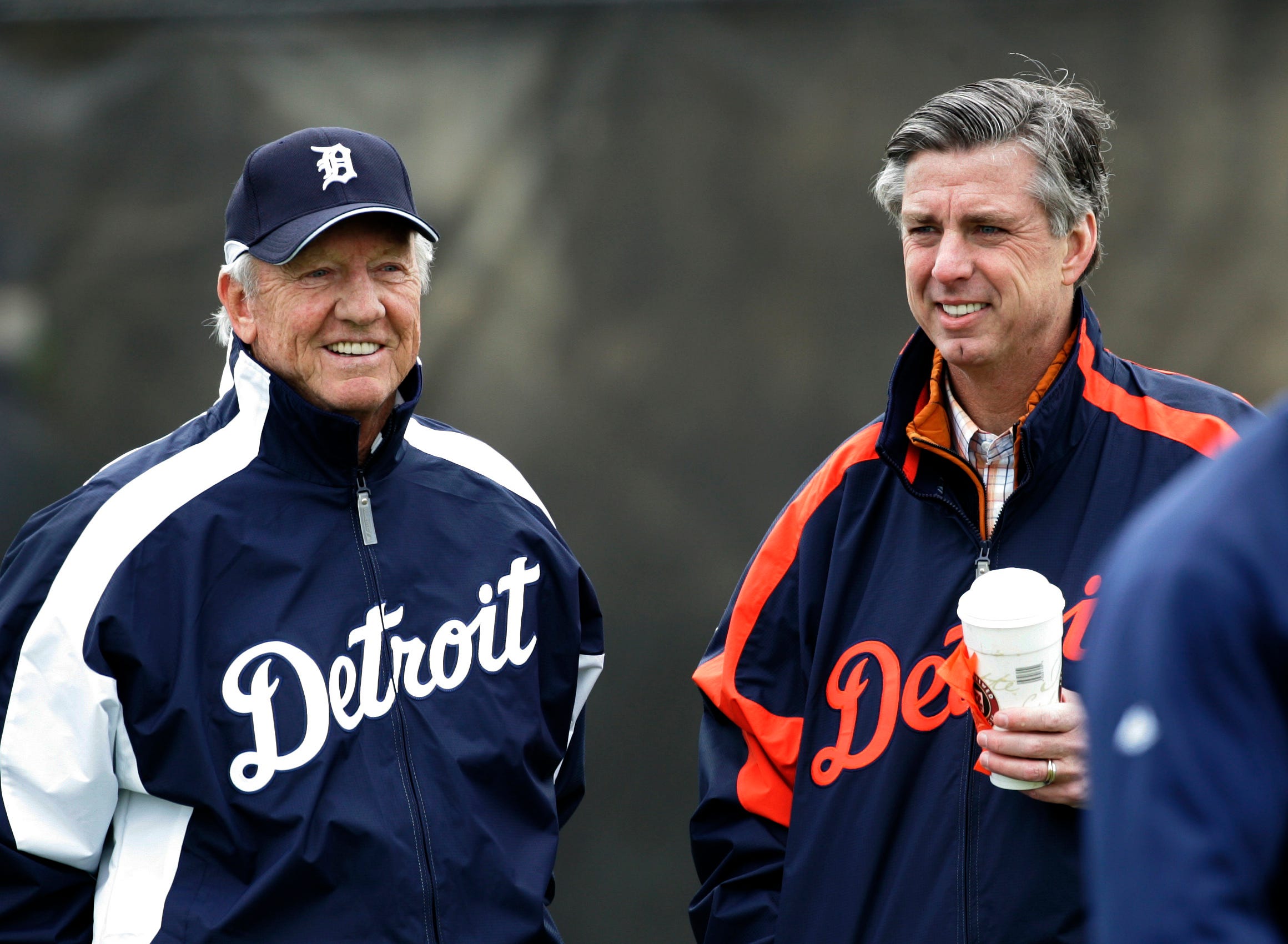 Detroit Tigers hall of famer Al Kaline (left) and Tigers general manager Dave Dombroski watch Detroit Tigers players warm up on a cold day at spring training in Lakeland, Florida on February 16, 2007.