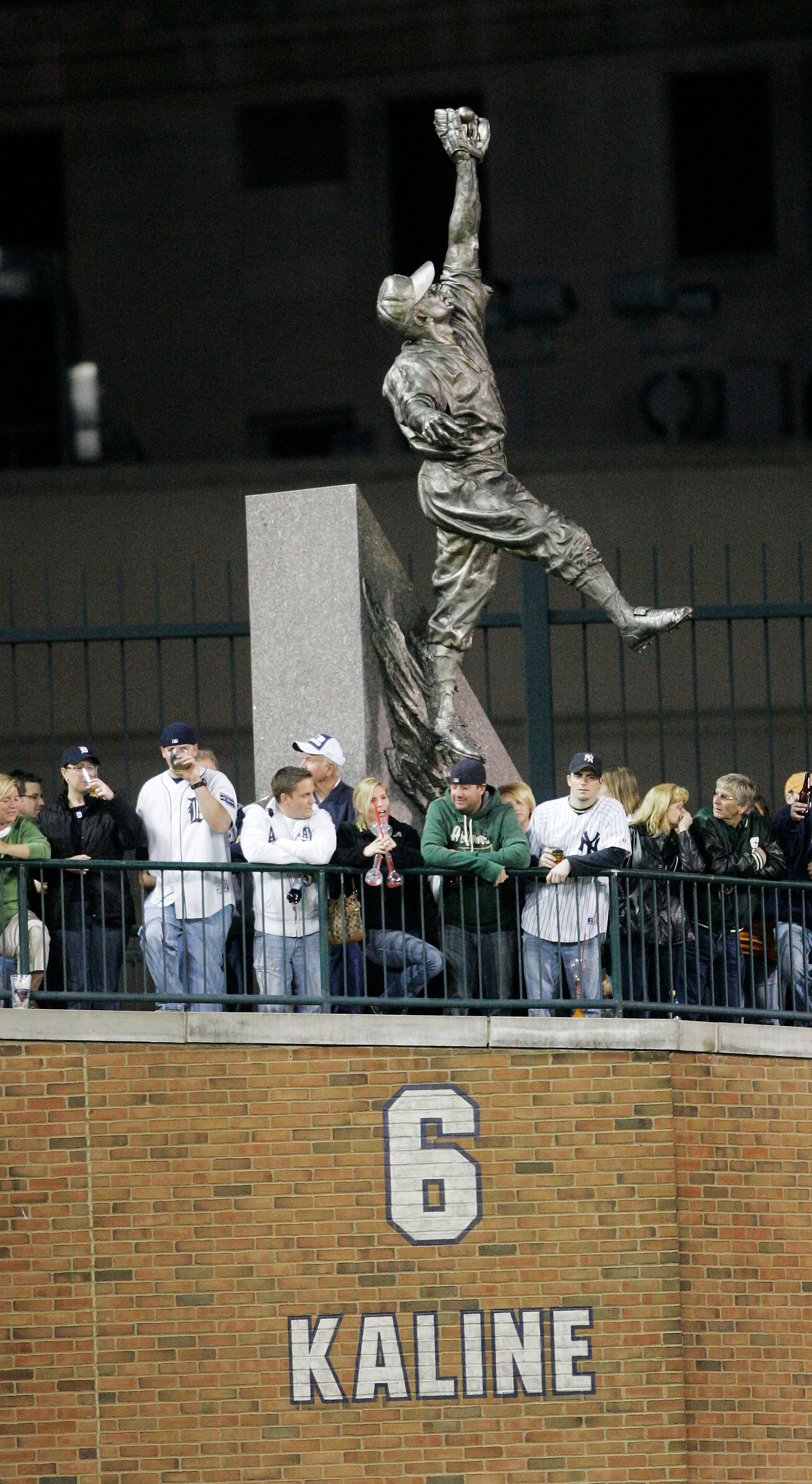 Fans watch the game from beyond left field among the statues , including this one of Al Kaline on Friday, May 9, 2008 at Comerica Park in Detroit.