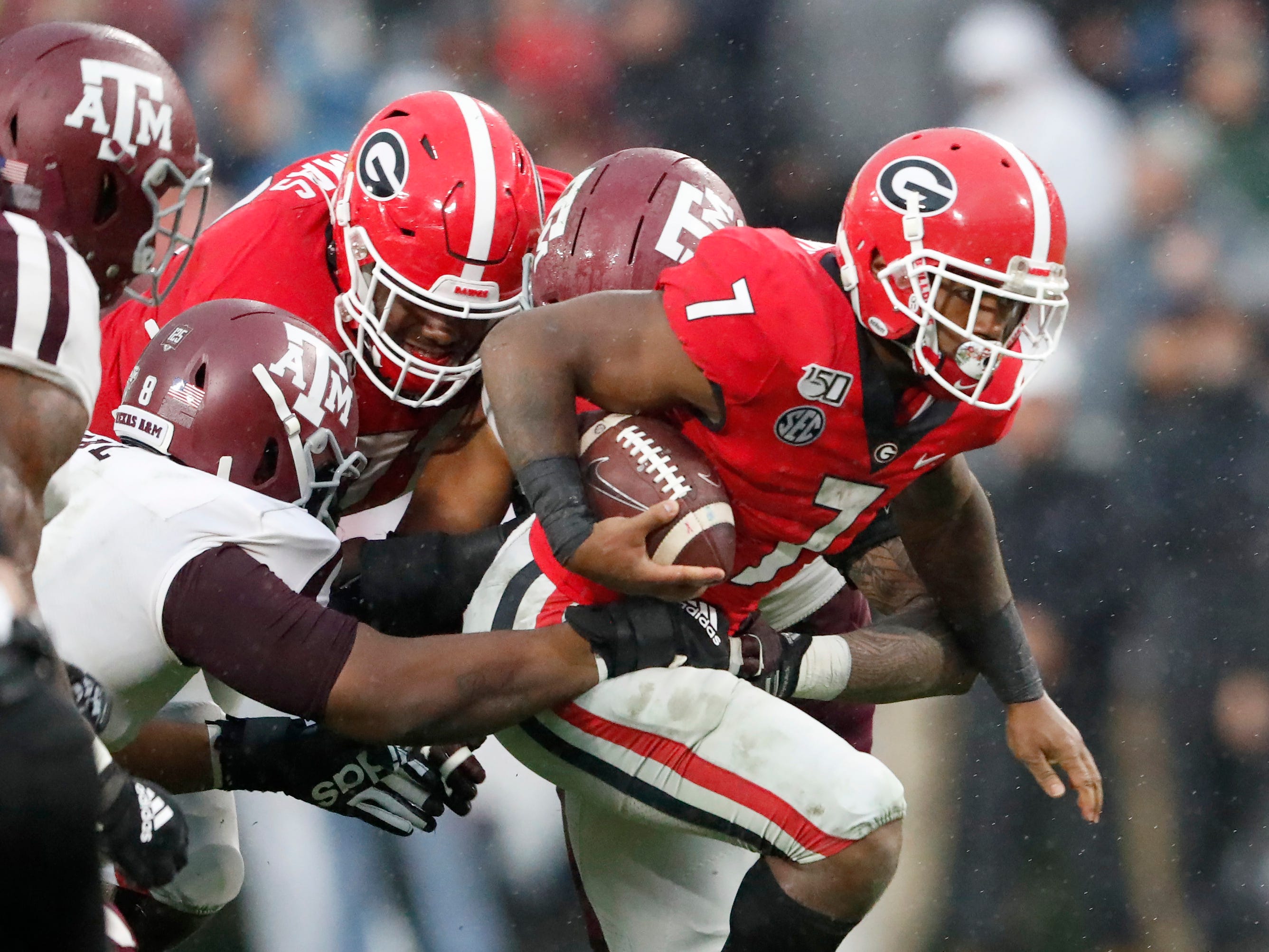 Georgia running back D'Andre Swift struggles for extra yardage against Texas A&M.