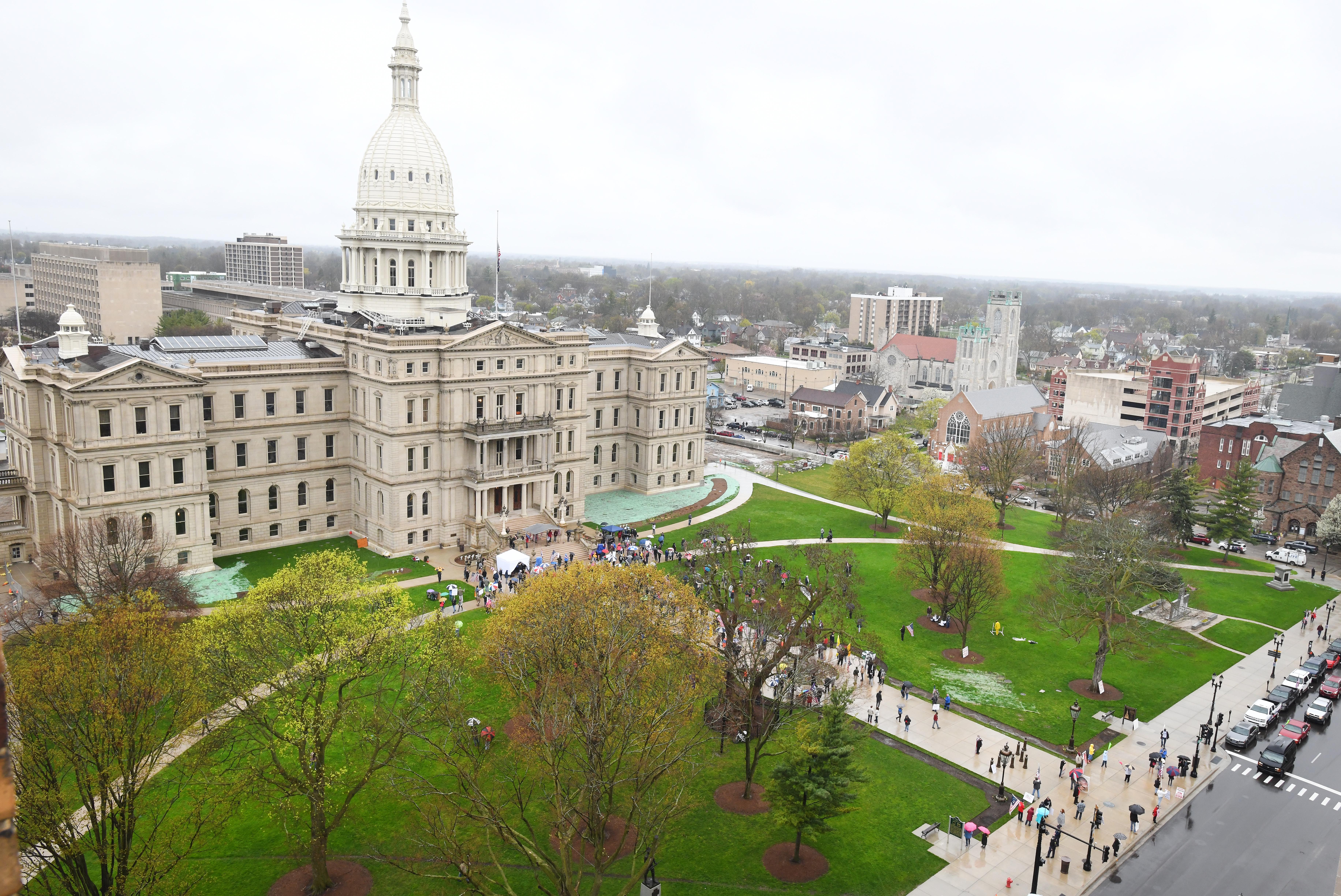 " American Patriot Rally, " in protest to Gov. Gretchen Whitmer ' s coronavirus pandemic polices, on the Michigan Capitol steps and lawn in Lansing on April 30, 2020.