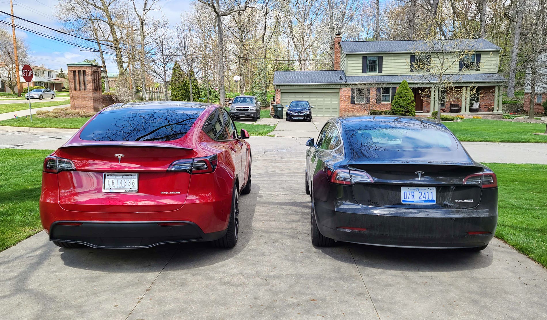 The differences between Tesla's Model Y, left, and Model 3 are most obvious in the rear, where the SUV gains a hatchback.