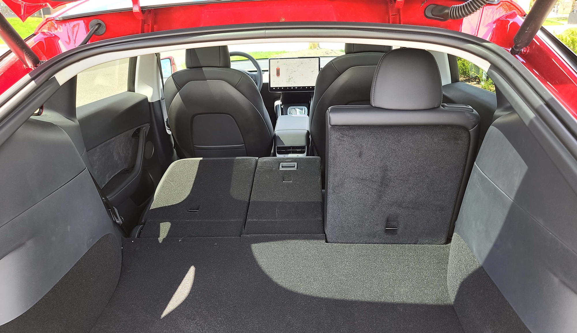 Flatten the Tesla Model Y's rear seats and it gains a whopping 68 cubic feet of cargo room.