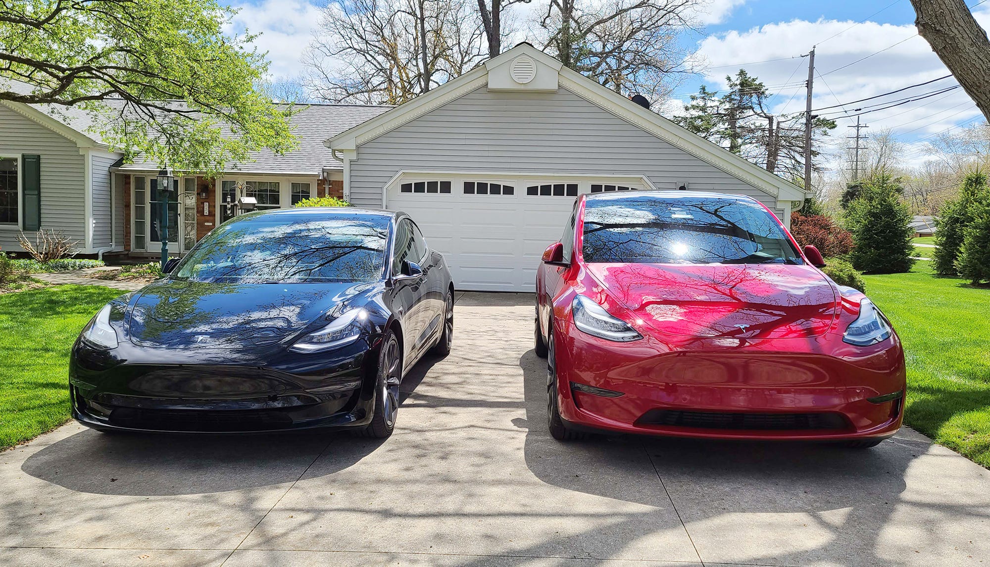 Similar faces, but the Tesla Model Y, right, is 7 inches taller than the Model 3 sedan.