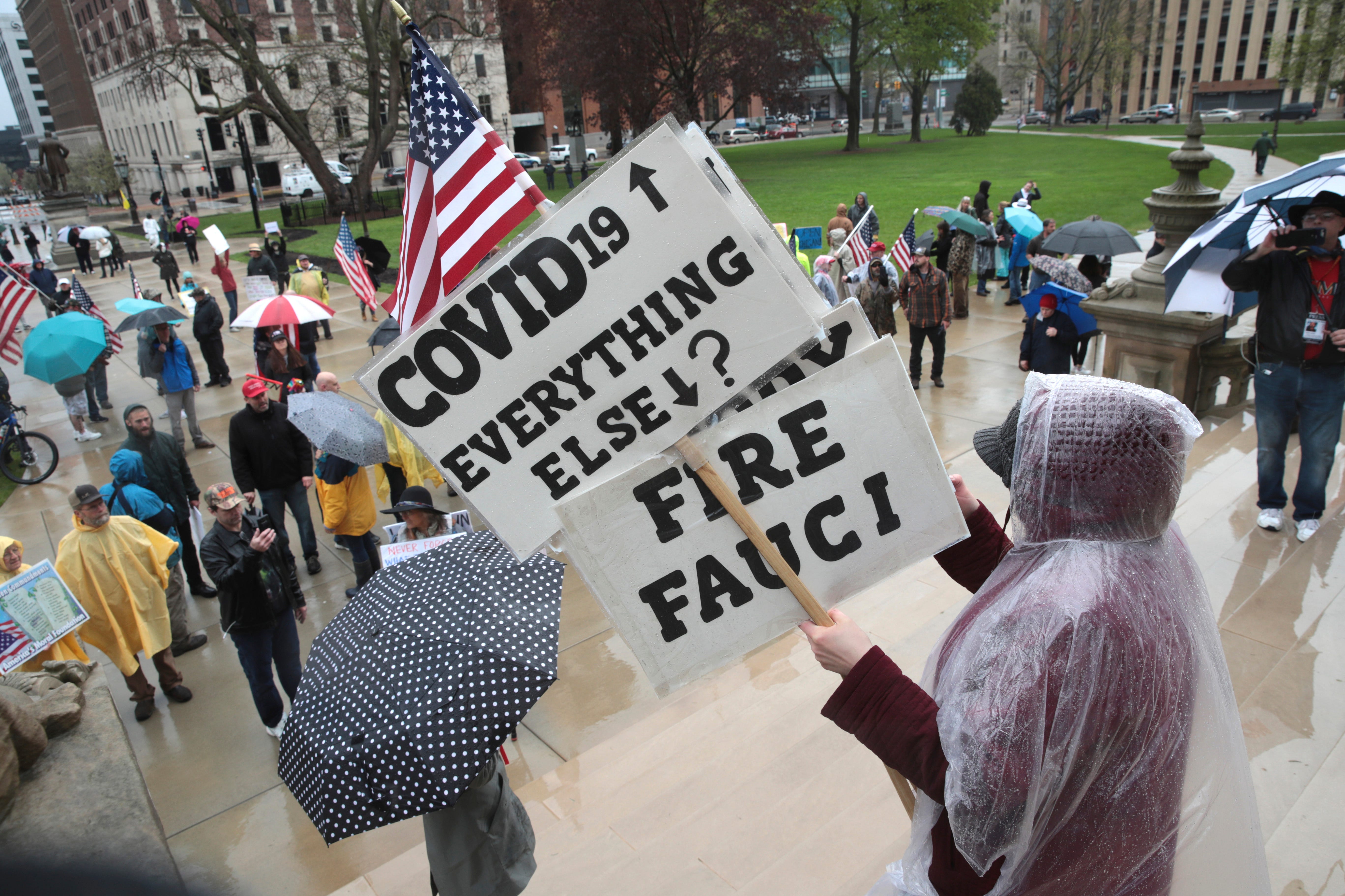 Protesters gather during a rally at the State Capitol in Lansing, Mich., Thursday, May 14, 2020.