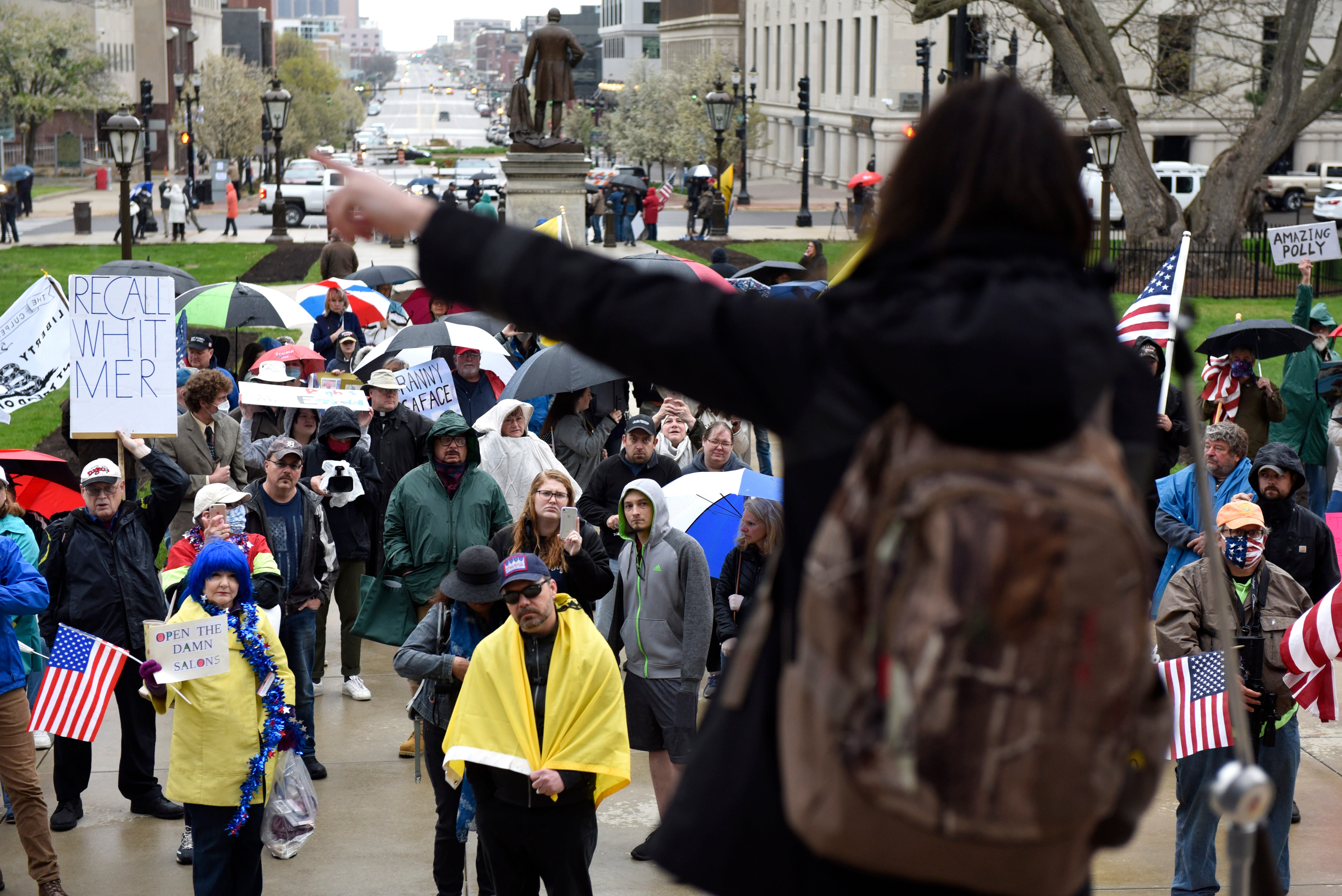 Protesters listen to a speaker during the protest at the state Capitol.