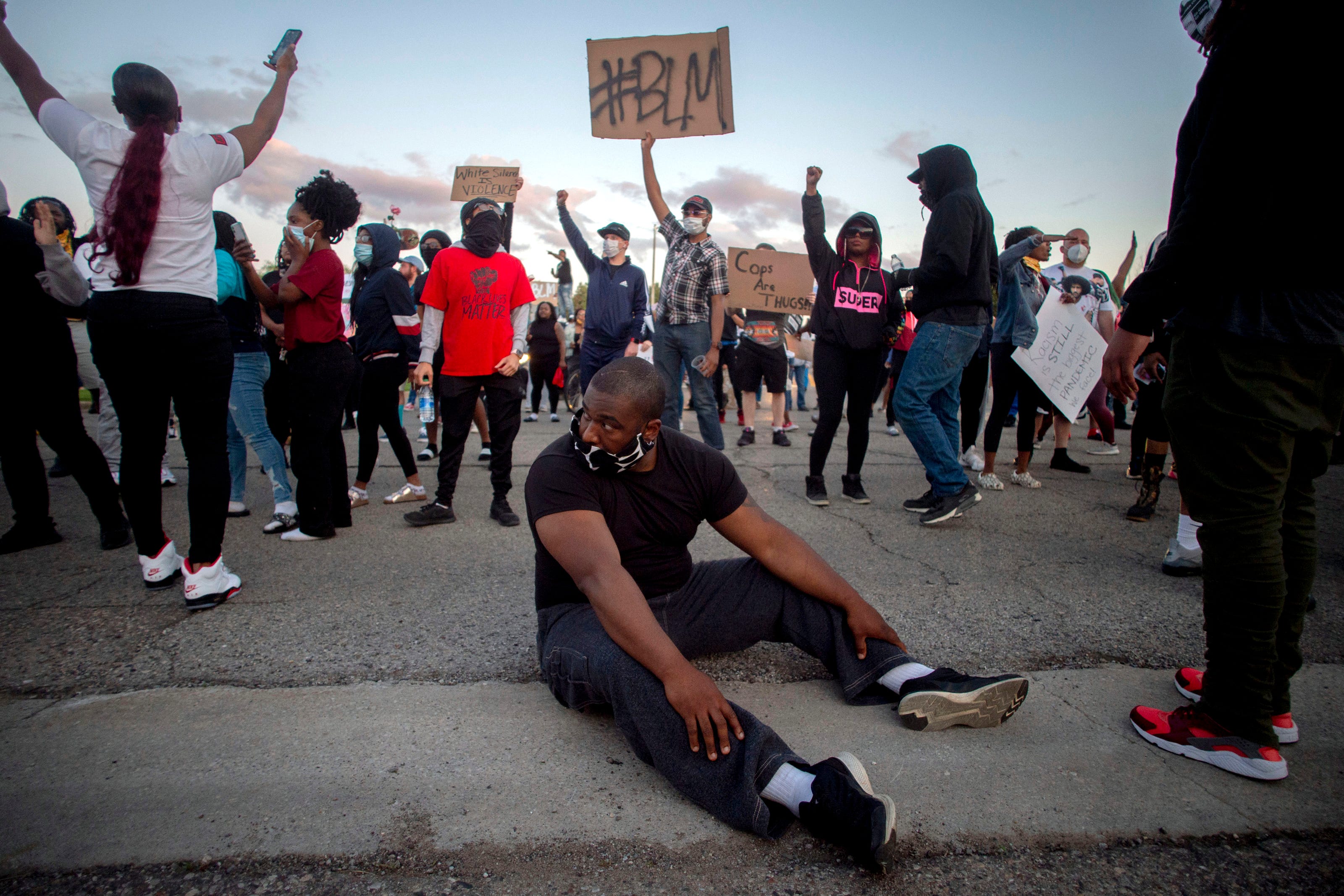 Protesters march during a peaceful protest seeking justice for George Floyd on Saturday, May 30, 2020 on Miller Road in Flint Township, M.I.  Floyd died in police custody on Memorial Day in Minneapolis.