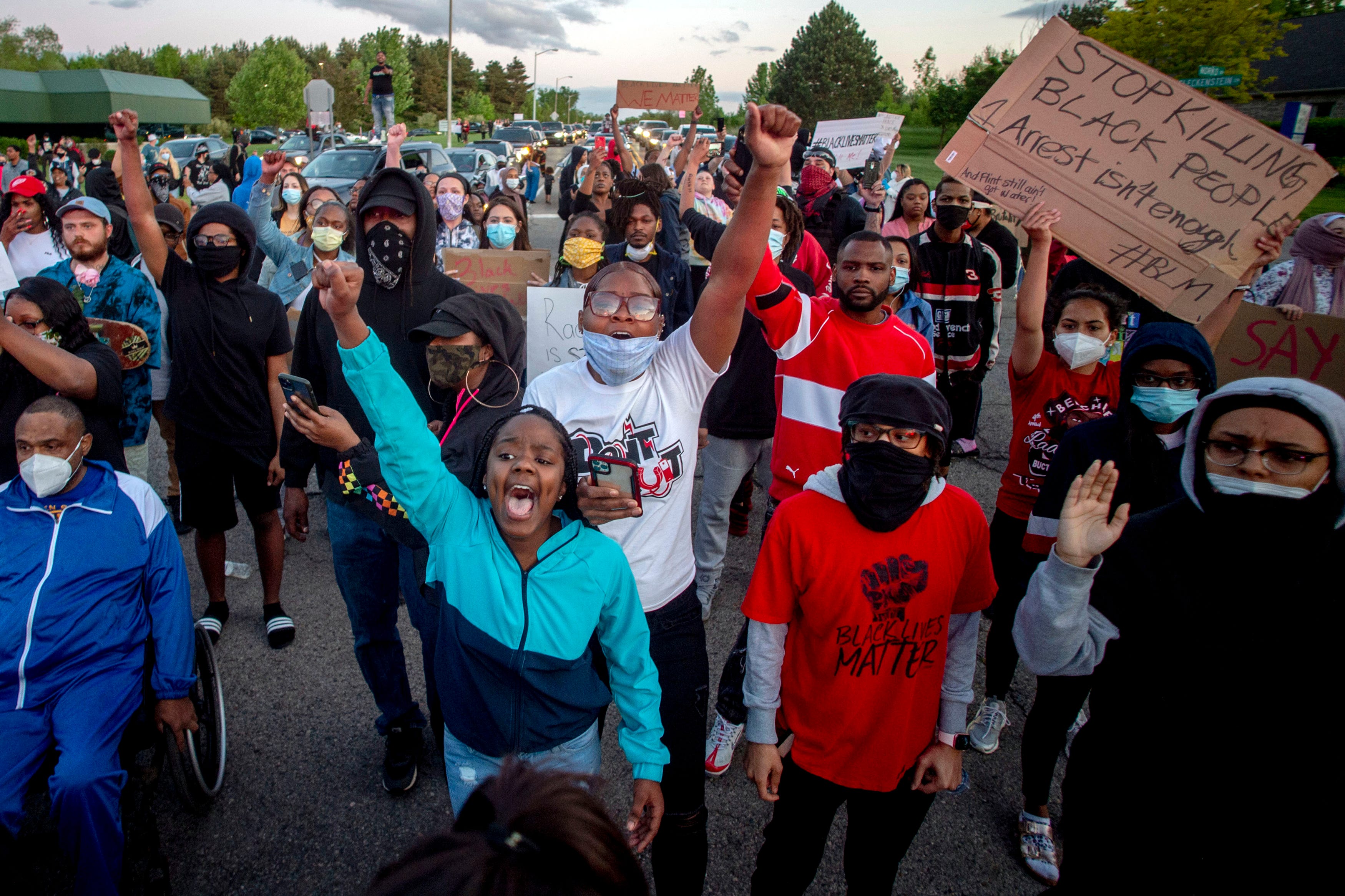 Protesters march during a peaceful protest in Flint, seeking justice for George Floyd.