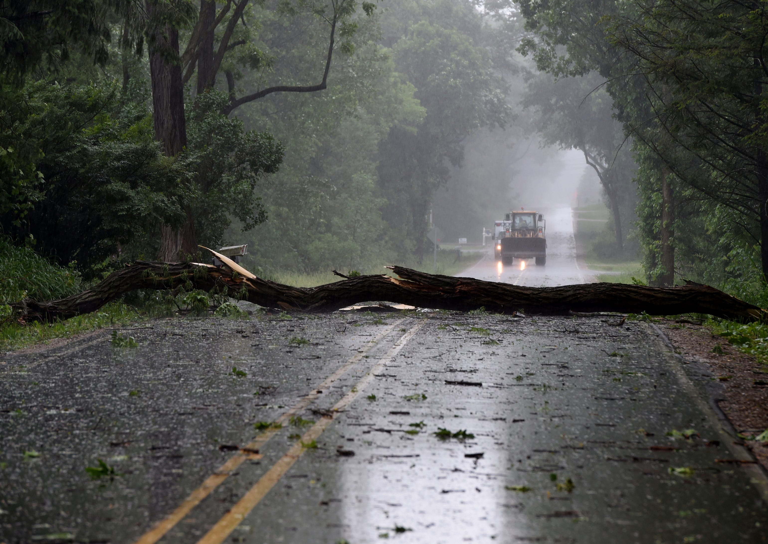 Storm damage is seen on Sandstone Road near McCain Road on Wednesday, June 10, 2020. Strong storms with heavy winds swept across Jackson County, Mich., causing power outages, downing trees and damaging property.