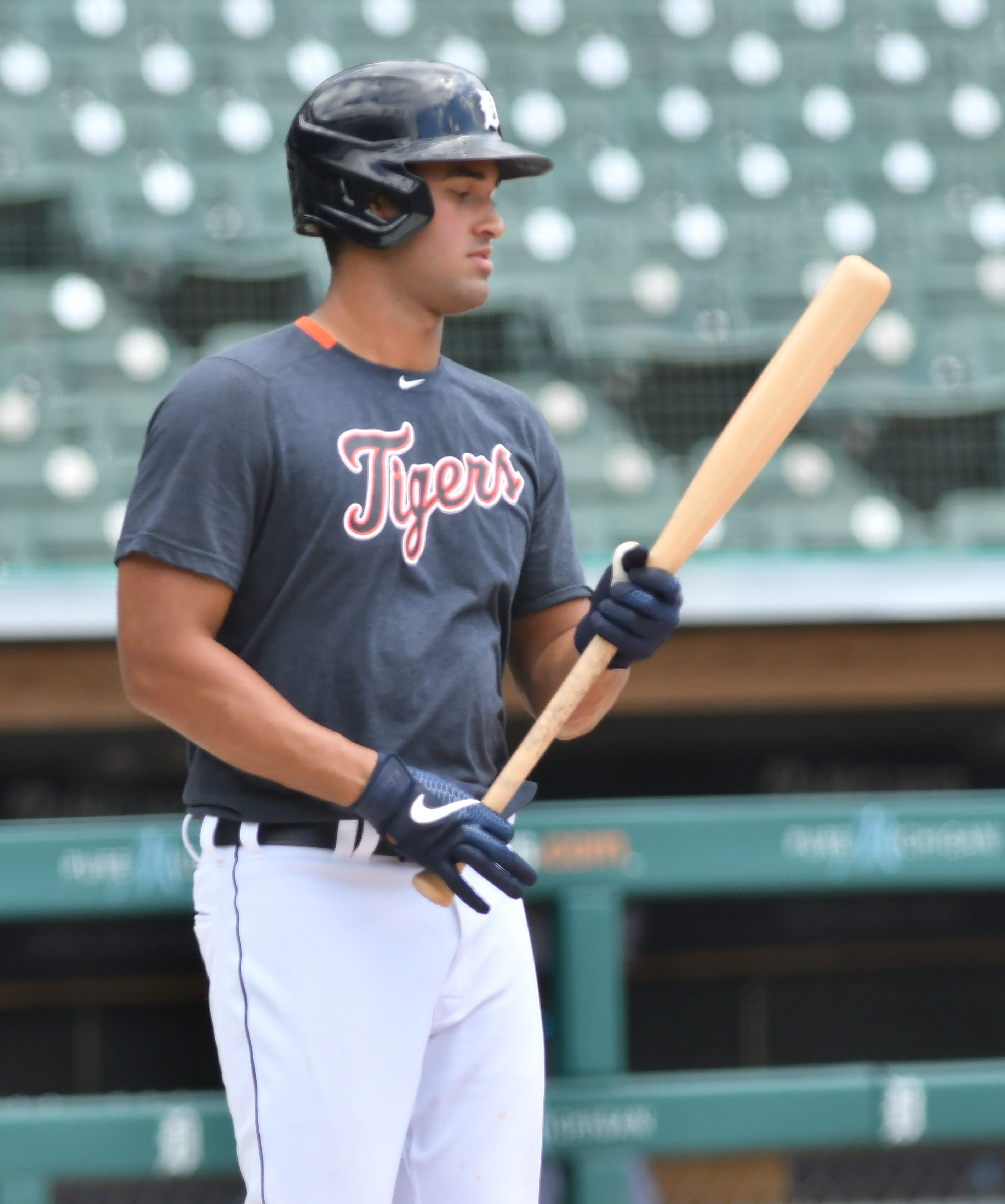 Non-roster invitee Riley Greene checks out his bat during live batting practice.