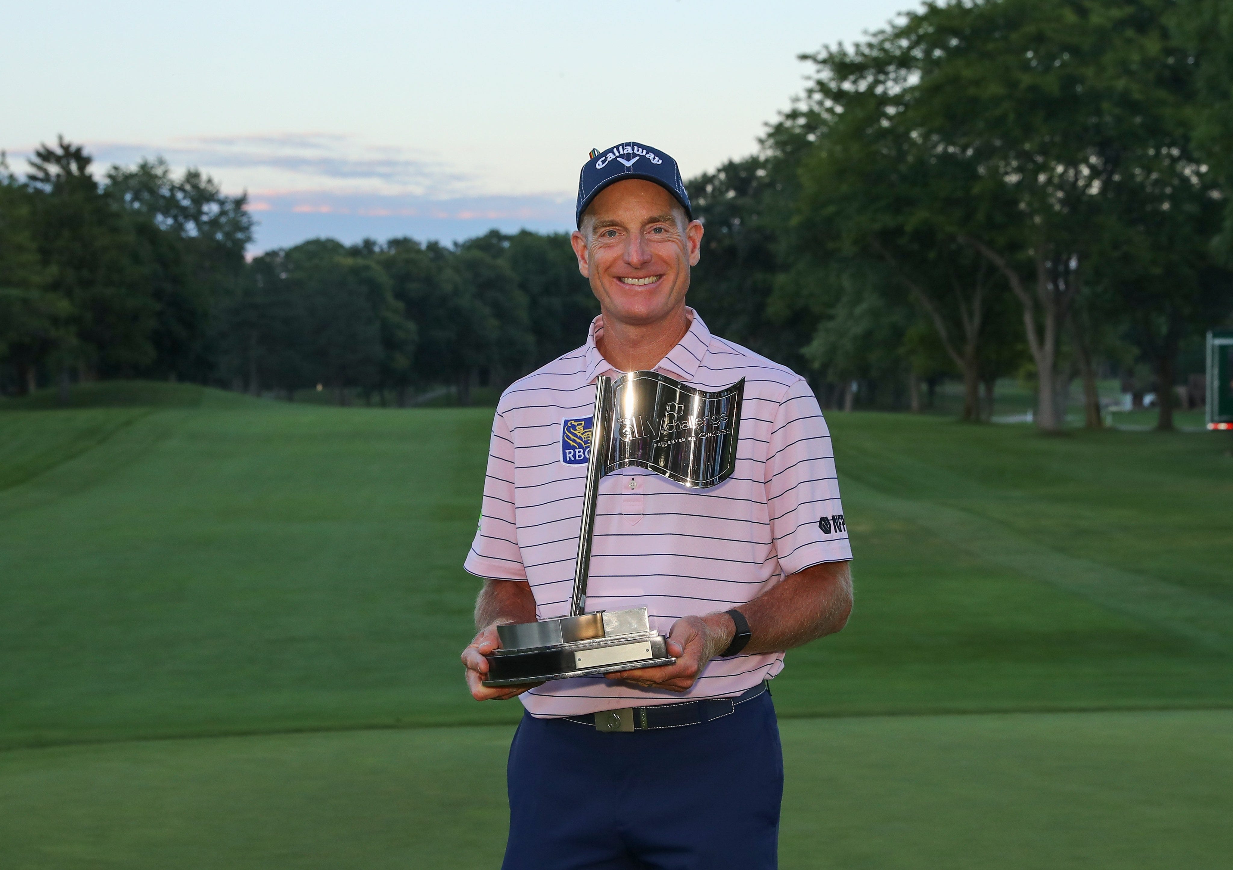 Jim Furyk holds the Ally Challenge trophy for his first Champions Tour win Sunday afternoon.