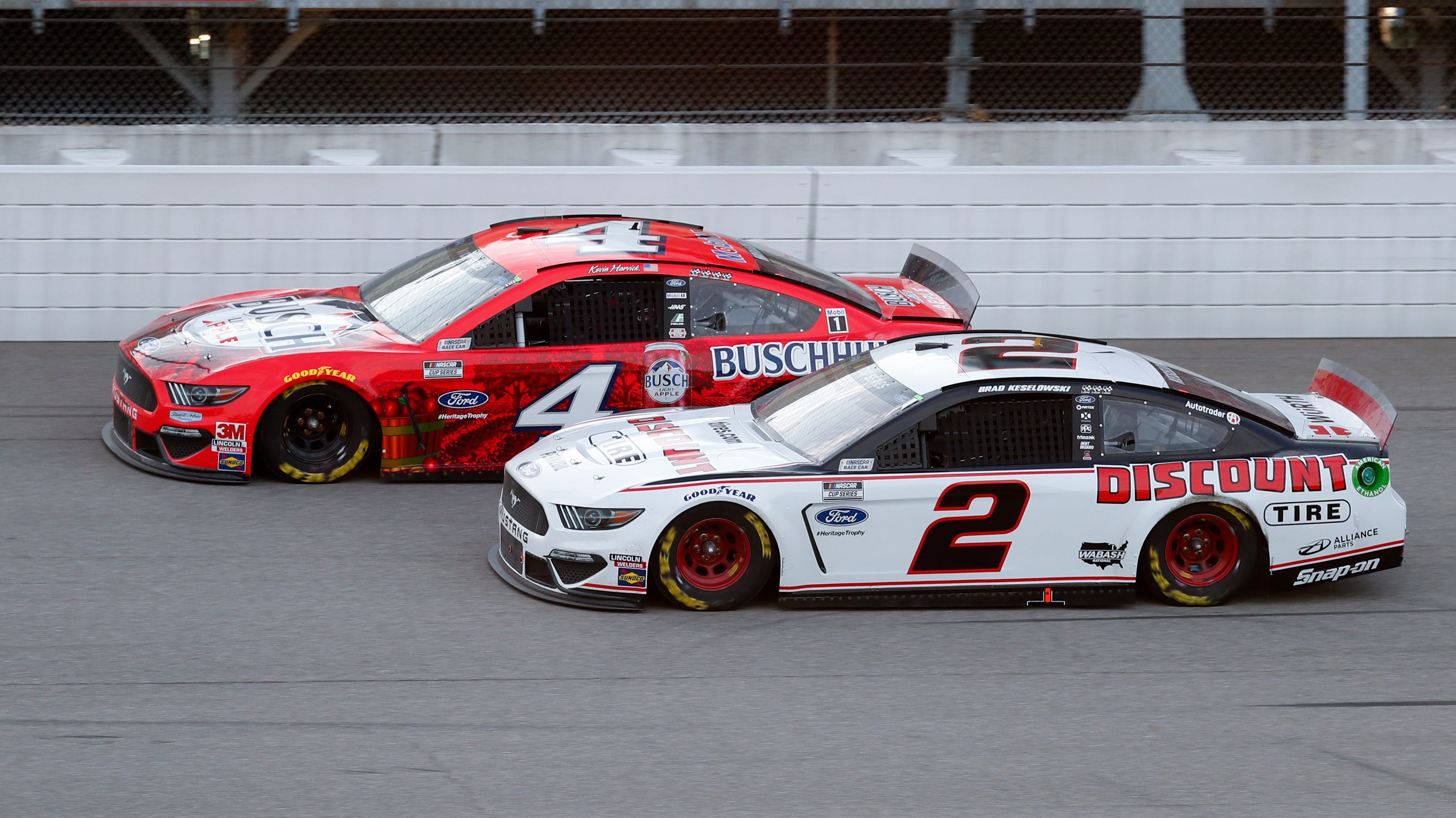 Kevin Harvick (4) competes with Brad Keselowski (2) during a NASCAR Cup Series auto race.