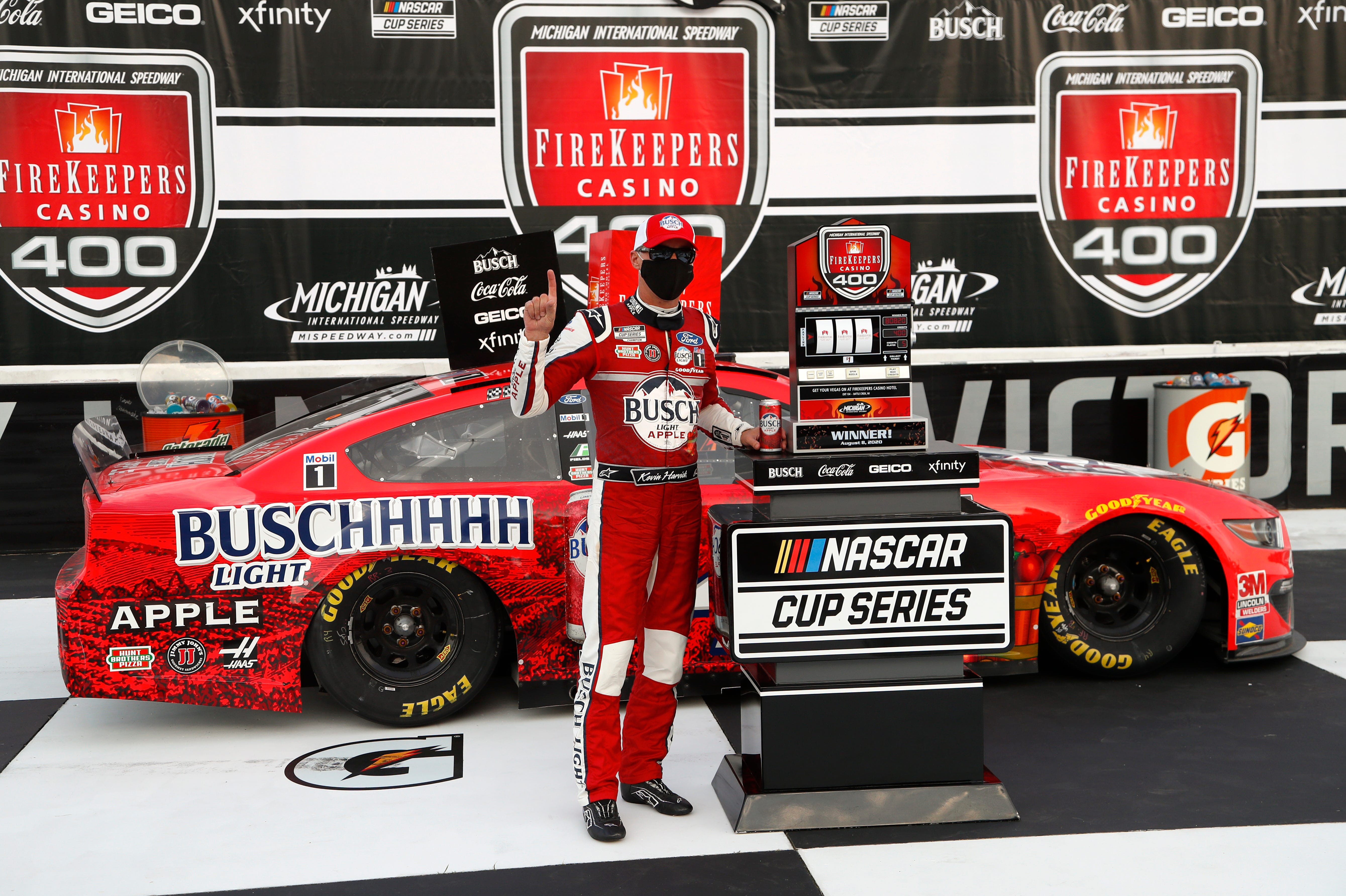 Kevin Harvick celebrates after winning a NASCAR Cup Series auto race at Michigan International Speedway.