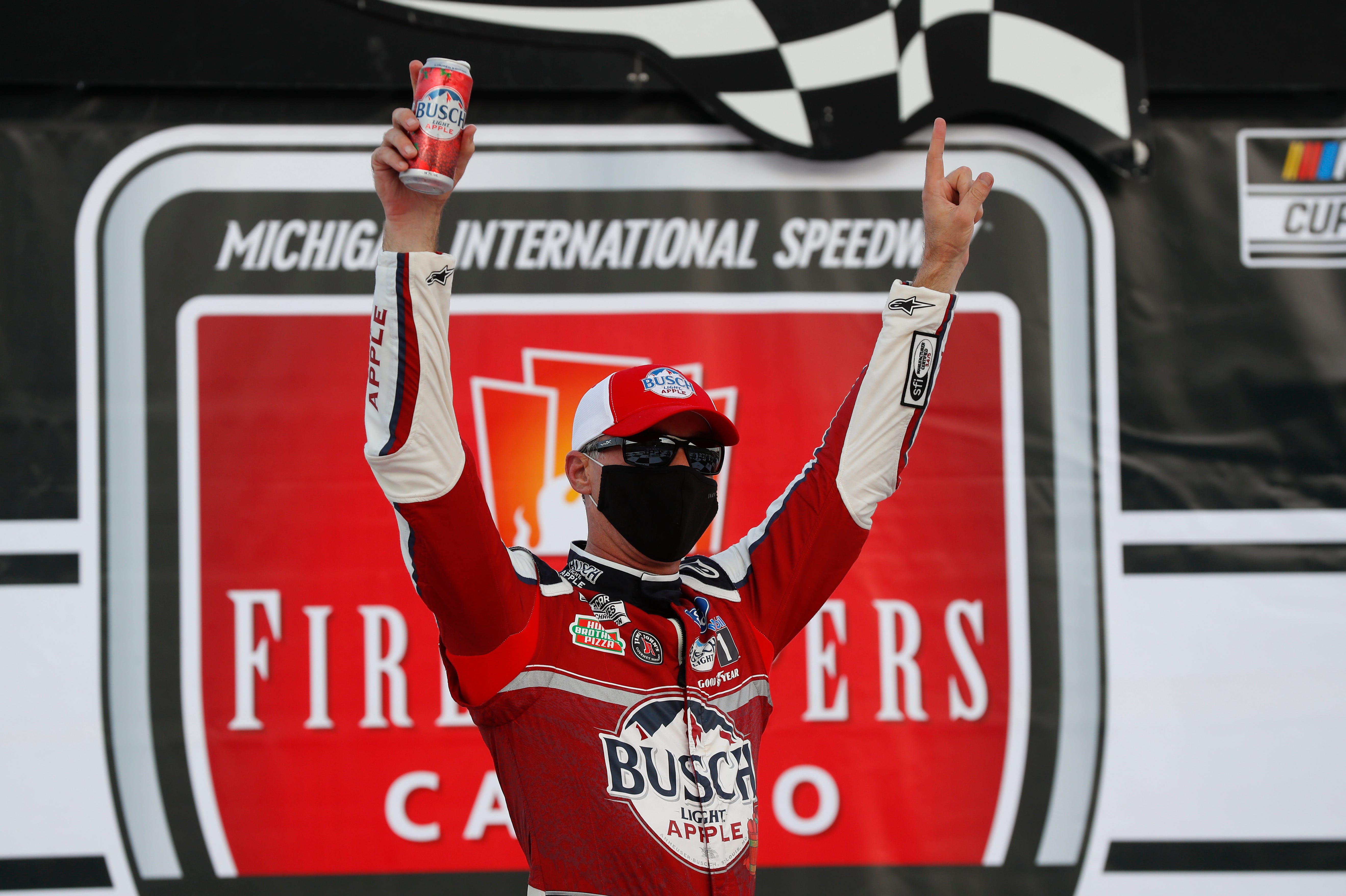 Kevin Harvick celebrates after winning a NASCAR Cup Series auto race at Michigan International Speedway in Brooklyn, Mich., Saturday, Aug. 8, 2020.