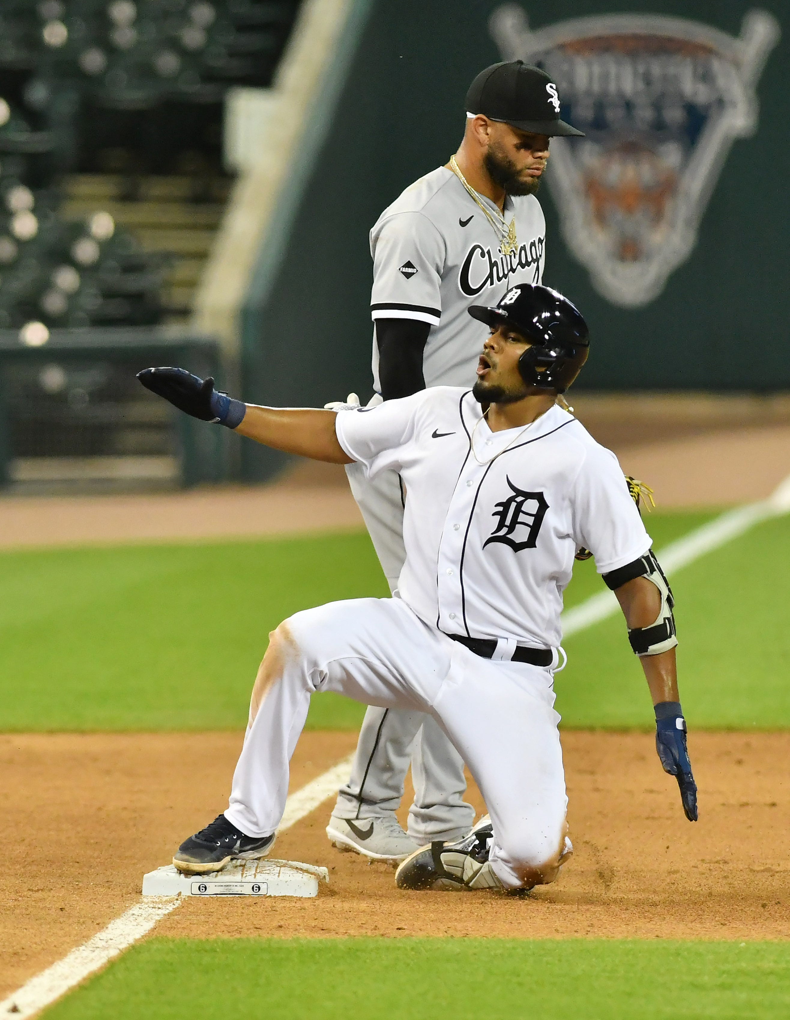 Tigers' Jeimer Candelario reacts as he reaches third base on his triple in the seventh inning.