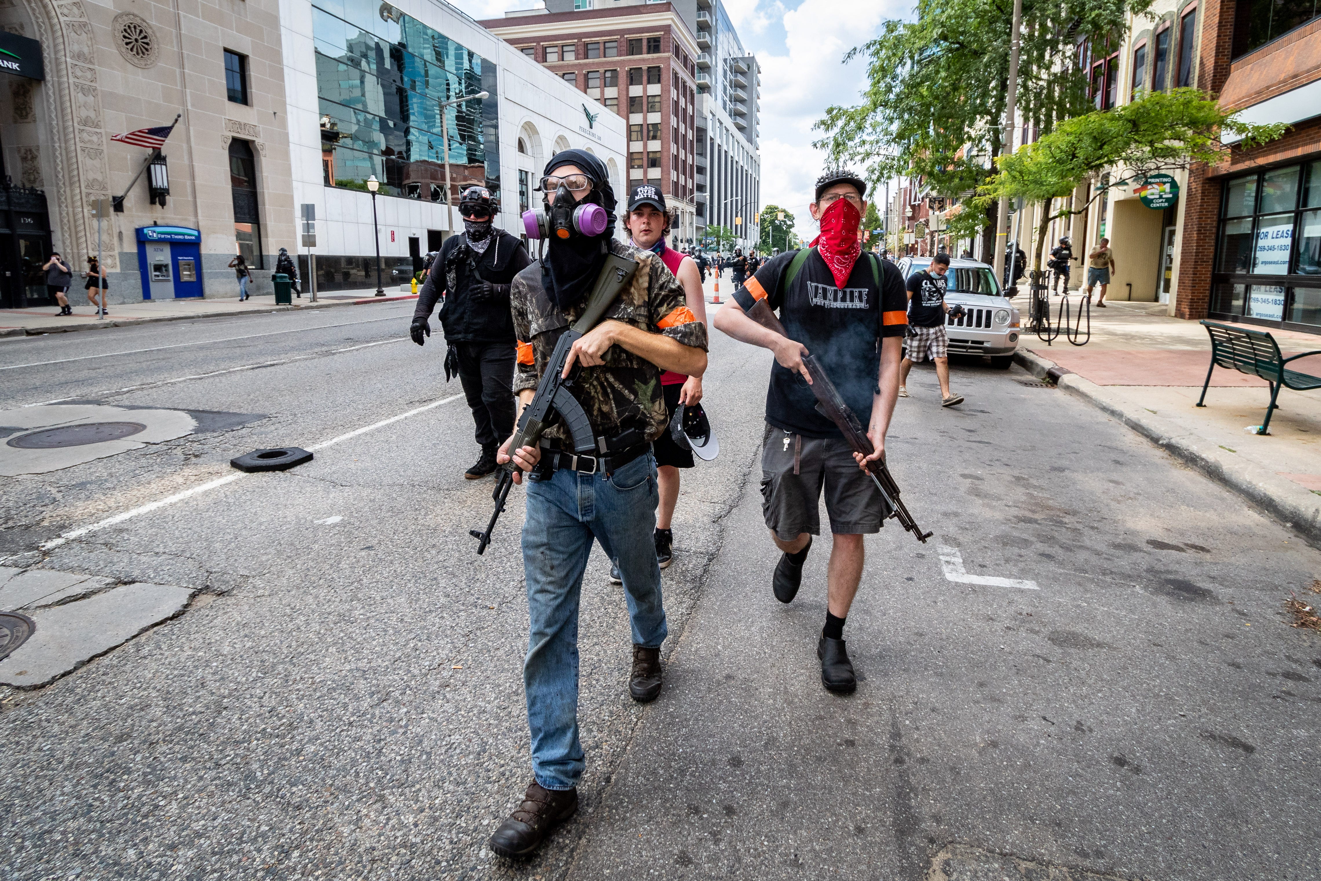 Antifa members carry assault weapons in downtown Kalamazoo protesting the presence of the Proud Boys. Members of Proud Boys, antifa, and a local church clash with each other and local and Michigan State Police at Arcadia Creek Festival Plaza in Kalamazoo on August 15, 2020.