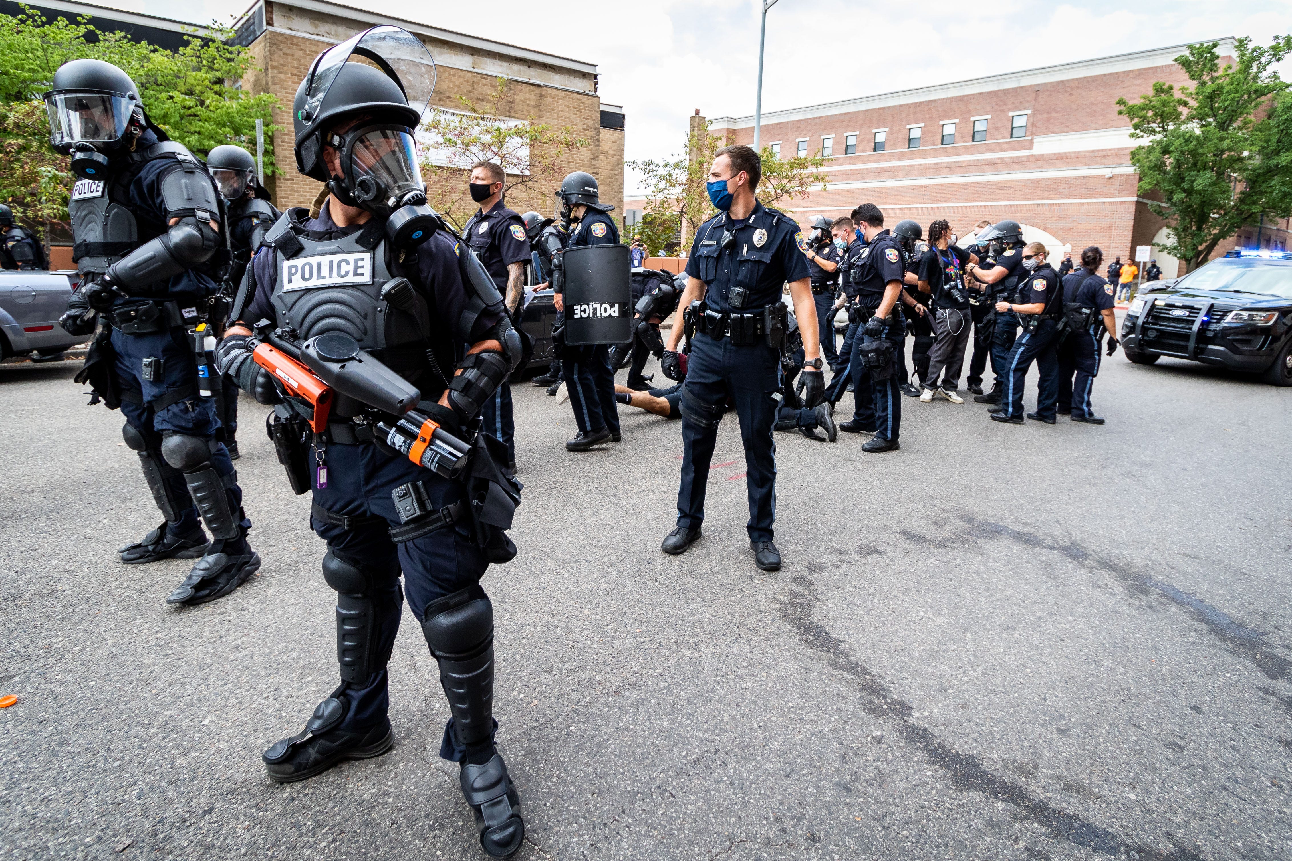 Kalamazoo Police arrest a counter-protestor. Members of Proud Boys, antifa, and a local church clash with each other and local and Michigan State Police at Arcadia Creek Festival Plaza in Kalamazoo on August 15, 2020.