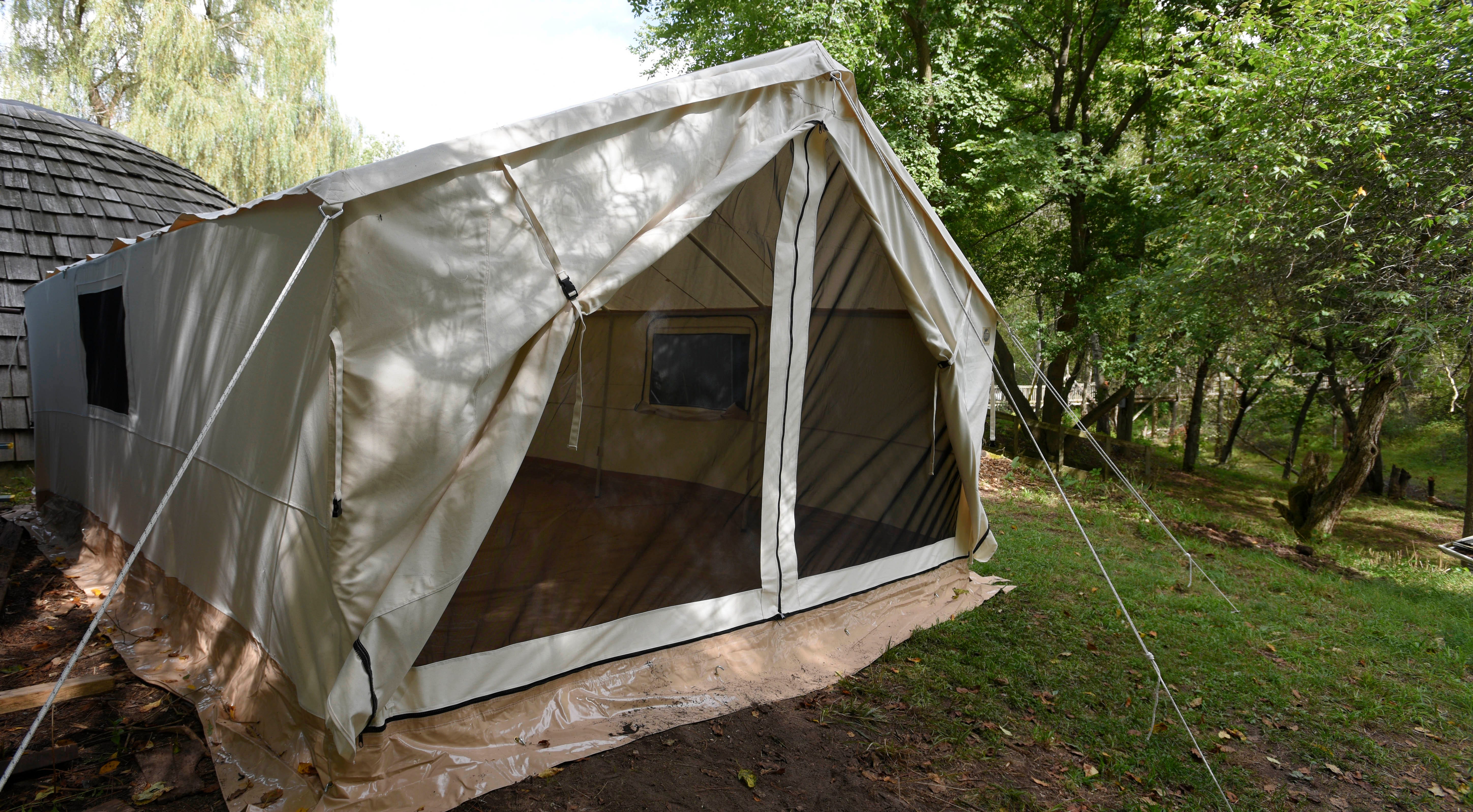 This is one of the new 12-foot by 32-foot, heavy-duty canvass, four-season tents that is raised off the ground. These tents will replace the old Army tents currently in use.
