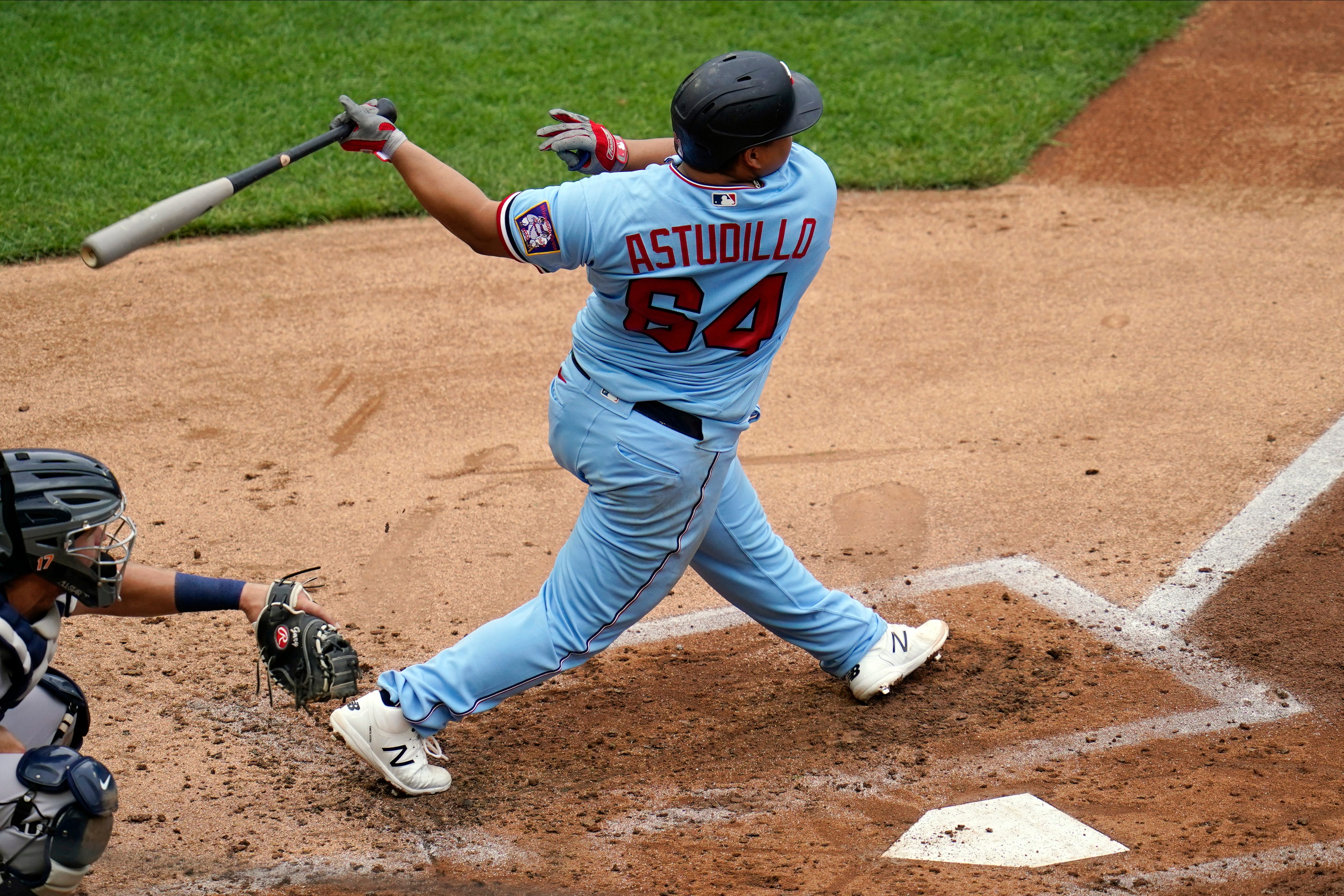 Minnesota Twins ' Willians Astudillo follows through on a two-run single in the third inning off Detroit Tigers pitcher Casey Mize.