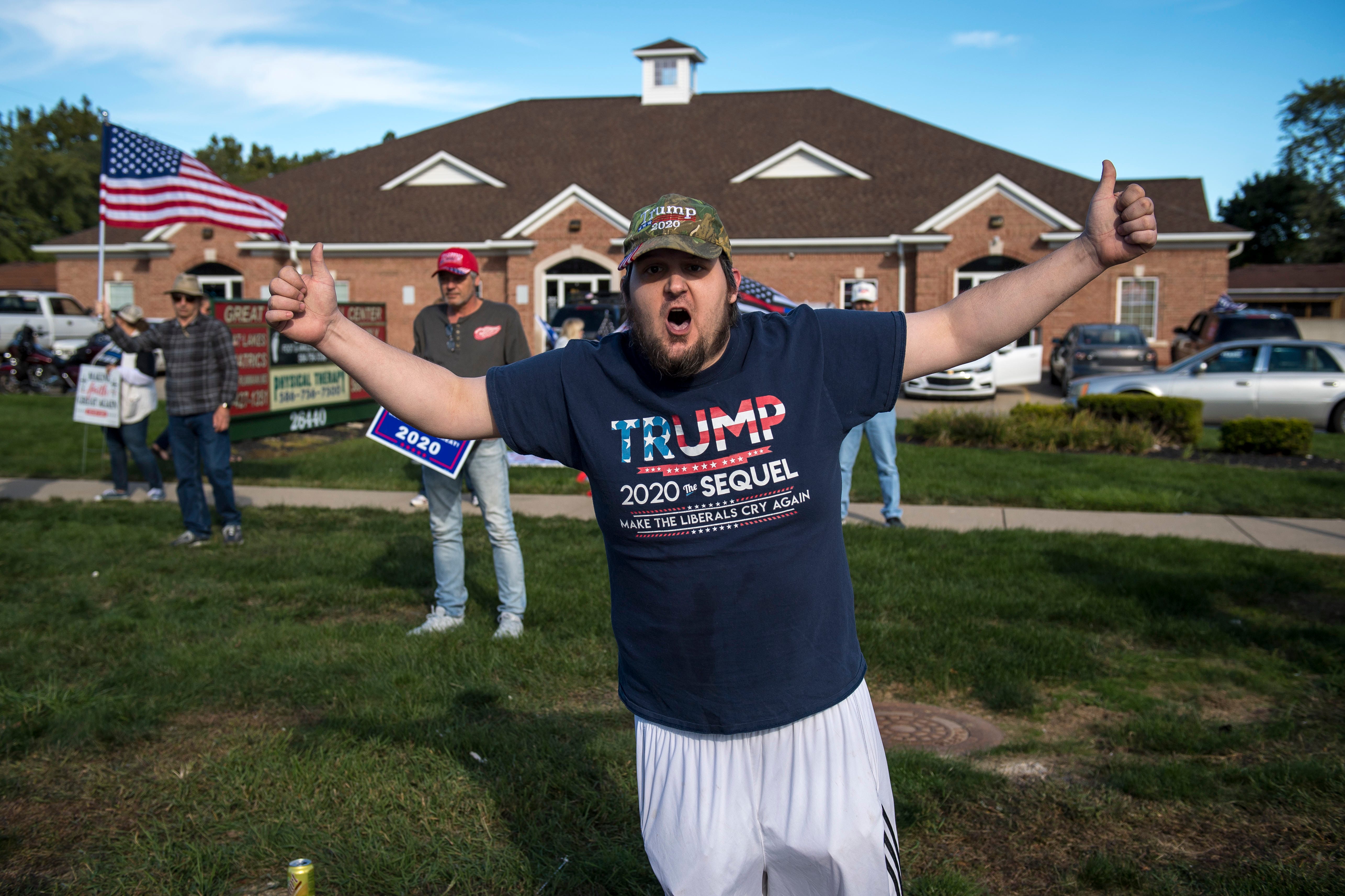 A Trump supporter yells at Detroit Will Breathe protesters before the March Against Racism in Warren on Sept. 19, 2020. The march in Warren occurred in response to the city called hate crimes against residents Candace Hall, her husband Eddie and their two children.