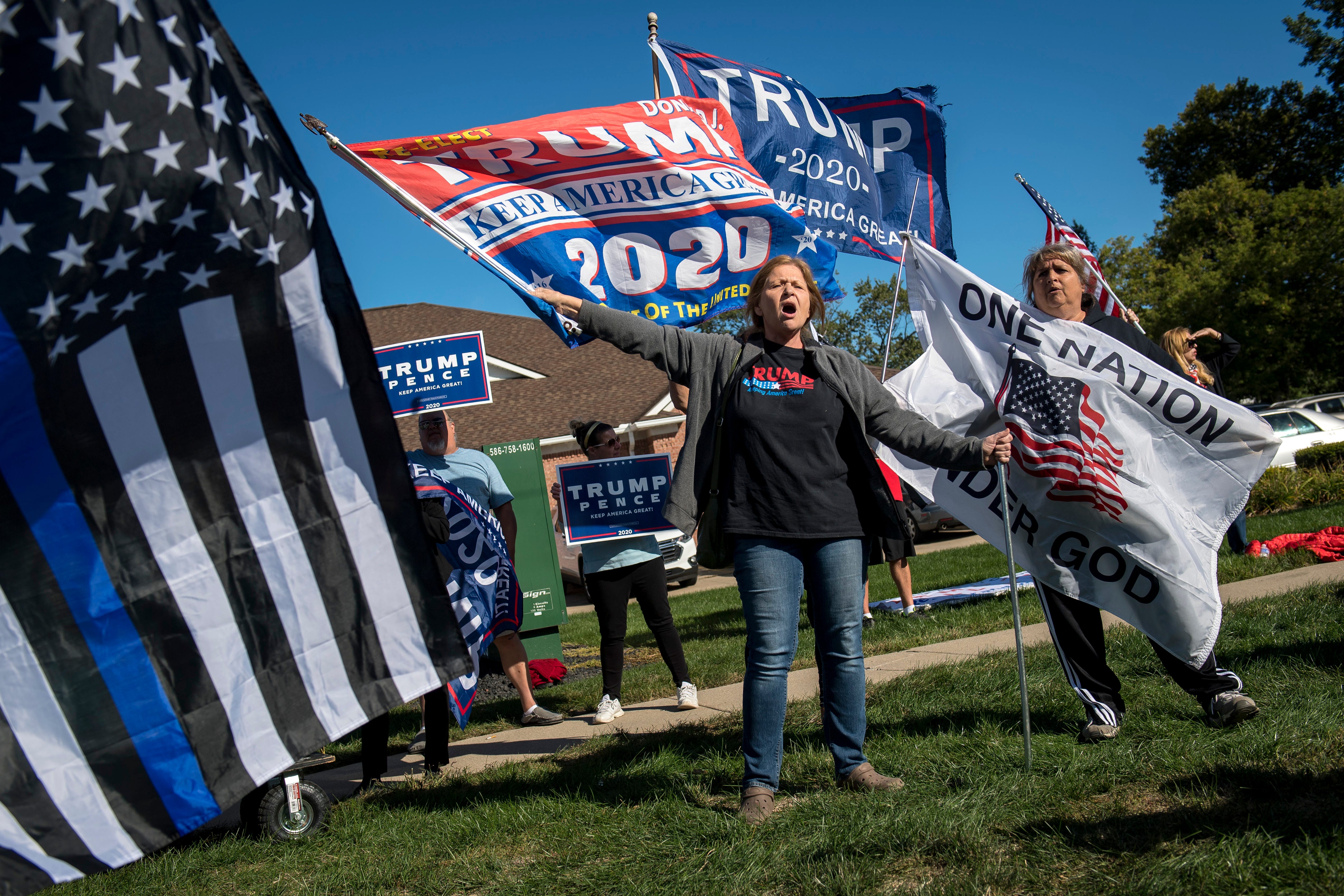 Trump supporters counter protest before the March Against Racism in Warren on Sept. 19, 2020. The march in Warren occurred in response to the city called hate crimes against residents Candace Hall, her husband Eddie and their two children.