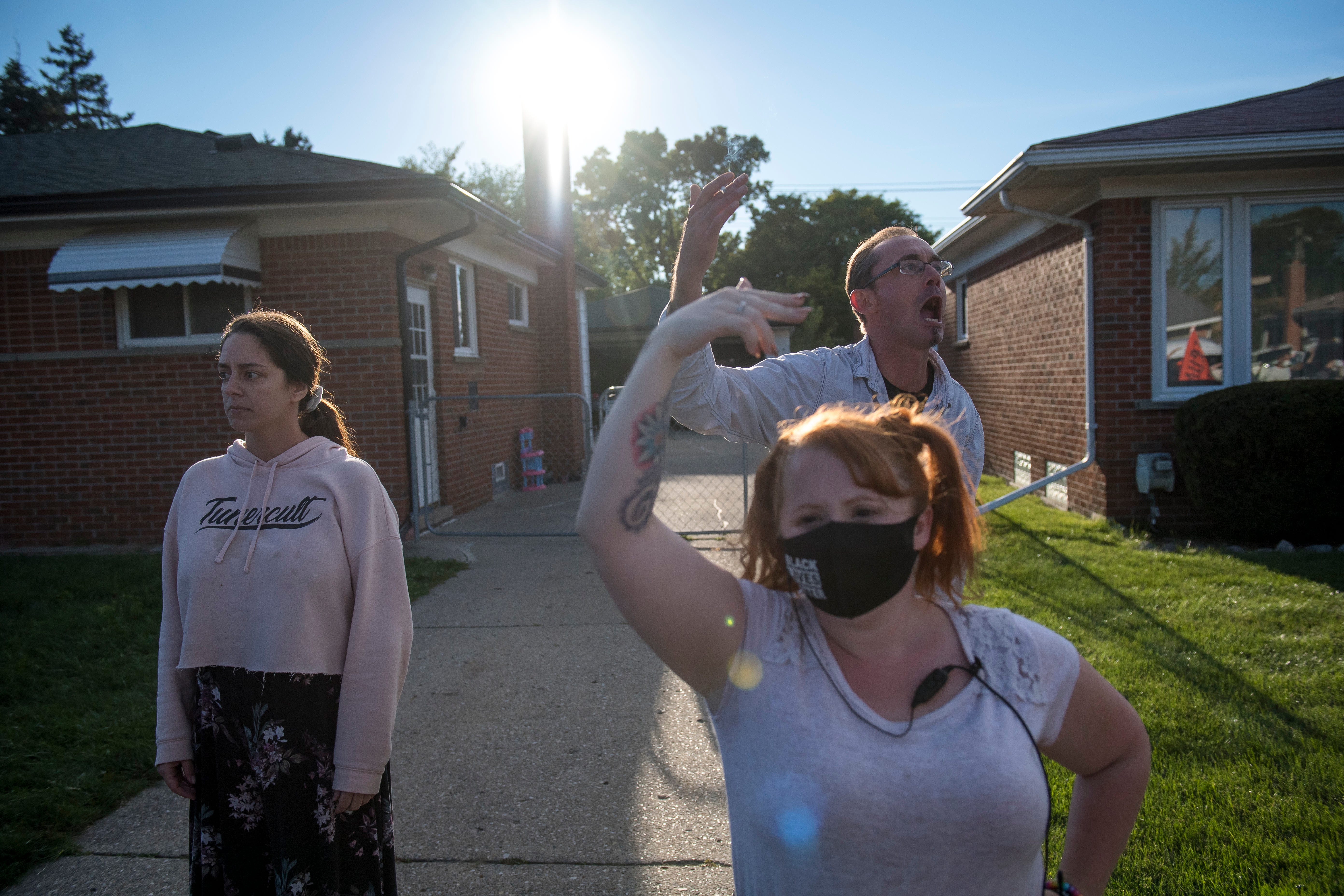 A Warren homeowner yells at protesters during the March Against Racism in Warren on Sept. 19, 2020. The march in Warren occurred in response to what the city called hate crimes that terrorized residents Candace Hall, her husband Eddie and their two children.