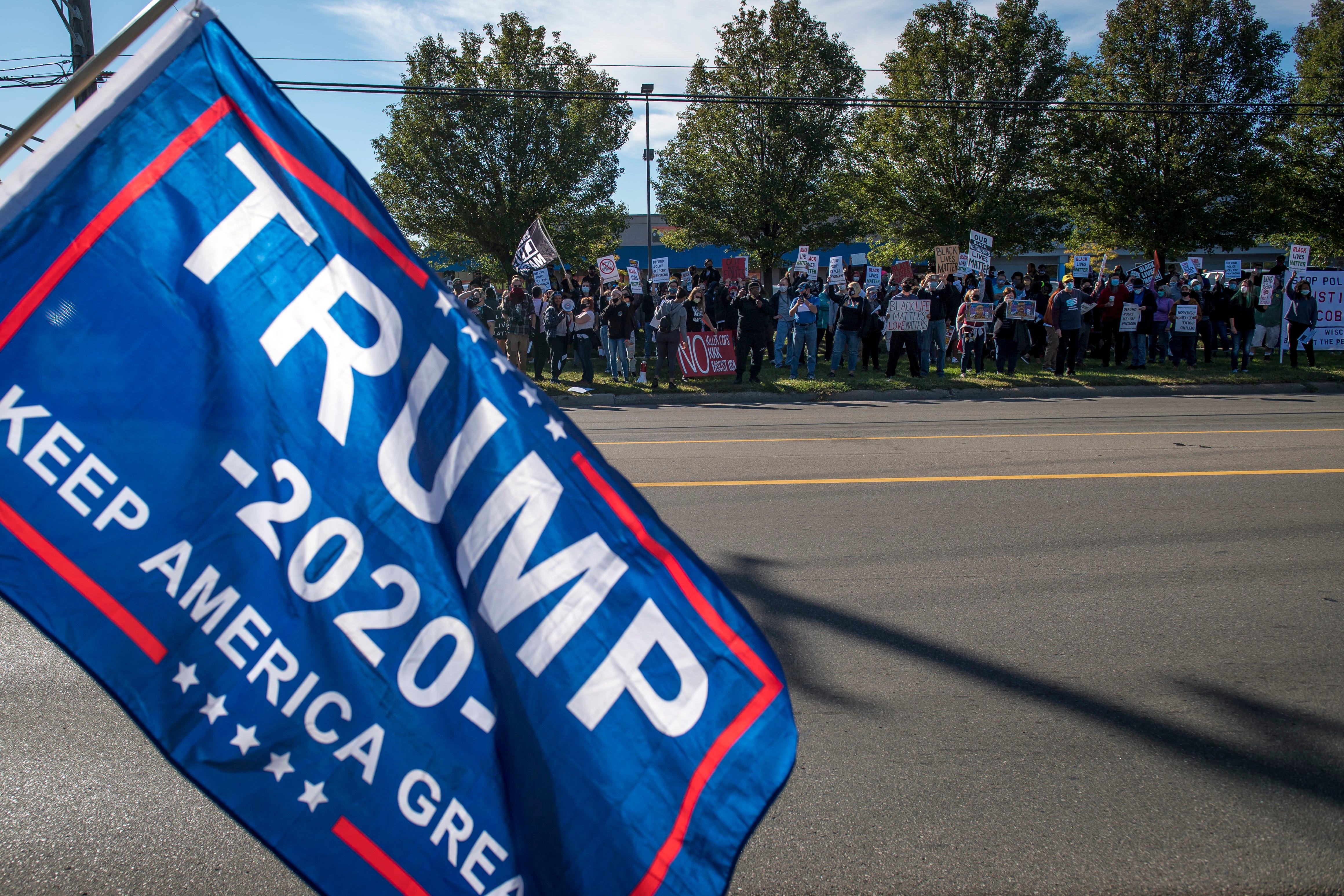 Trump supporters counter protest before the March Against Racism in Warren on Sept. 19, 2020. The march in Warren occurred in response to the city called hate crimes against residents Candace Hall, her husband Eddie and their two children.