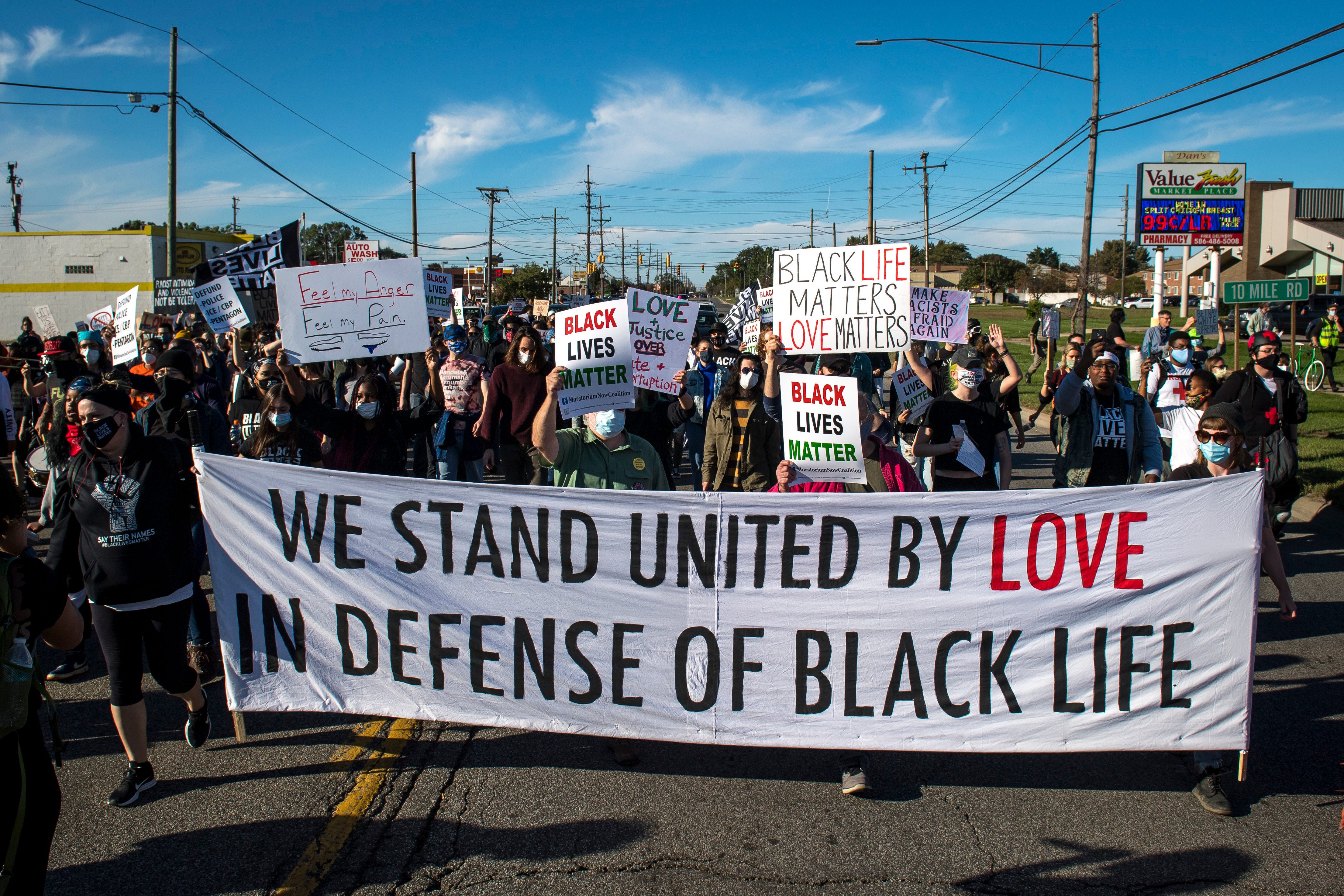 Protesters march during the March Against Racism in Warren on Sept. 19, 2020.