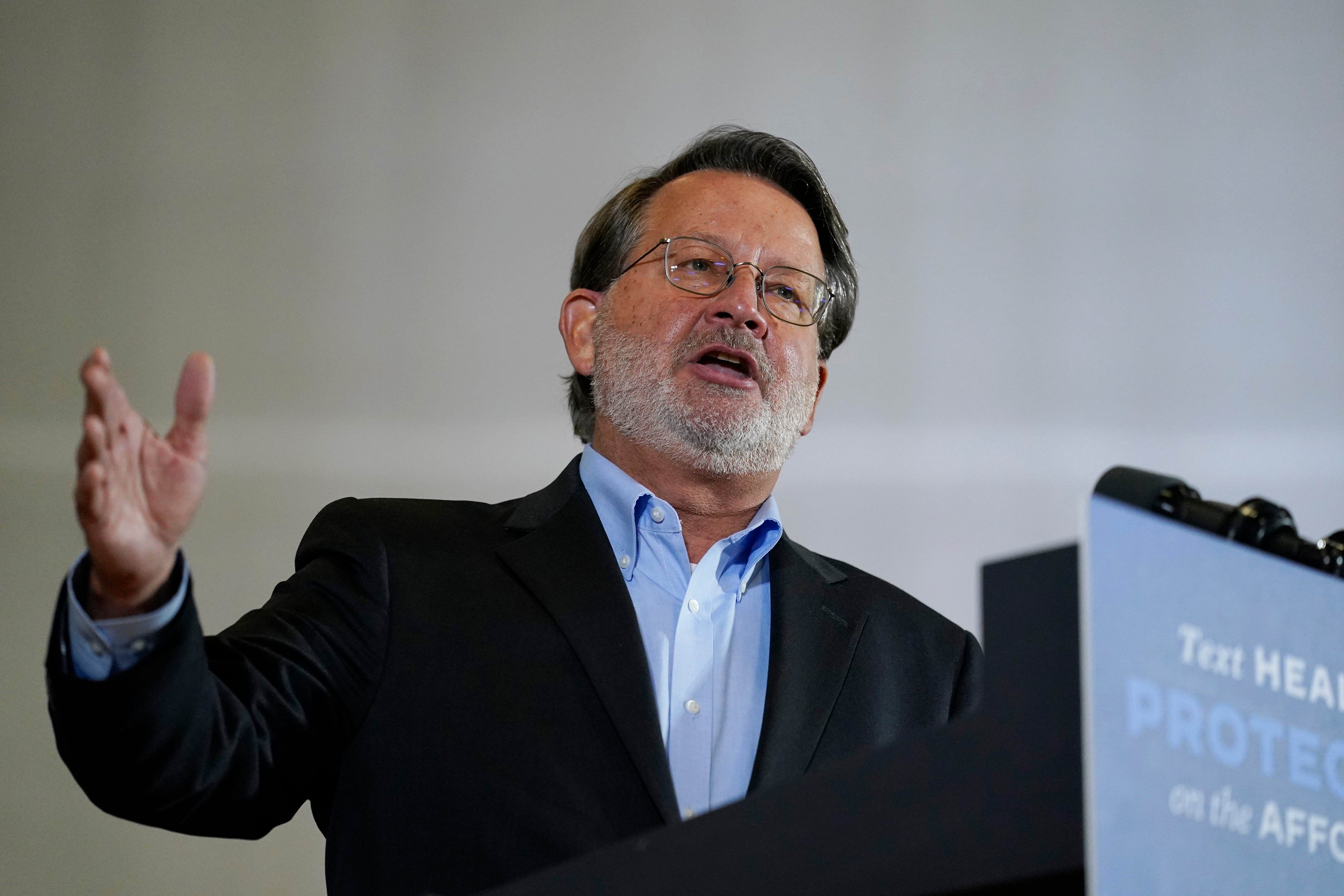 Sen. Gary Peters, D-Mich., speaks during an event with Democratic presidential candidate former Vice President Joe Biden at Beech Woods Recreation Center, in Southfield, Mich., Friday, Oct. 16, 2020.