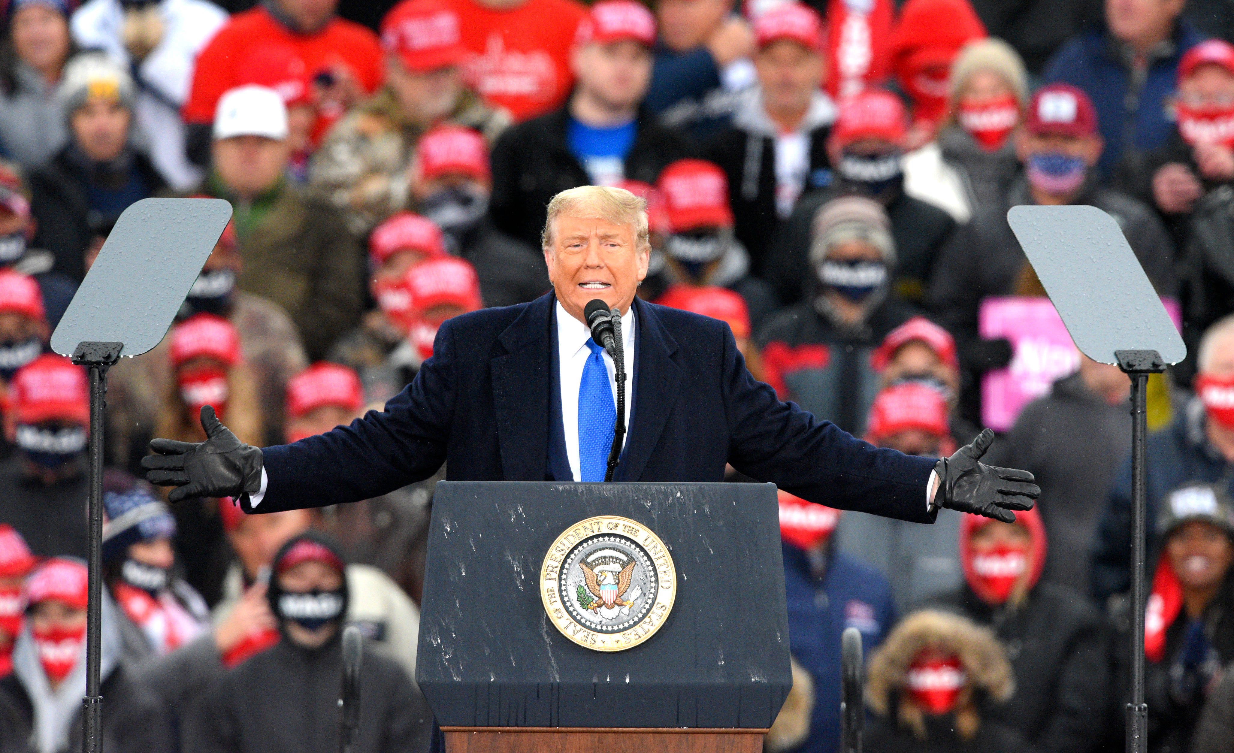 President Donald Trump addresses his supporters during a campaign rally at the Capital Region International Airport in Lansing, Tuesday.