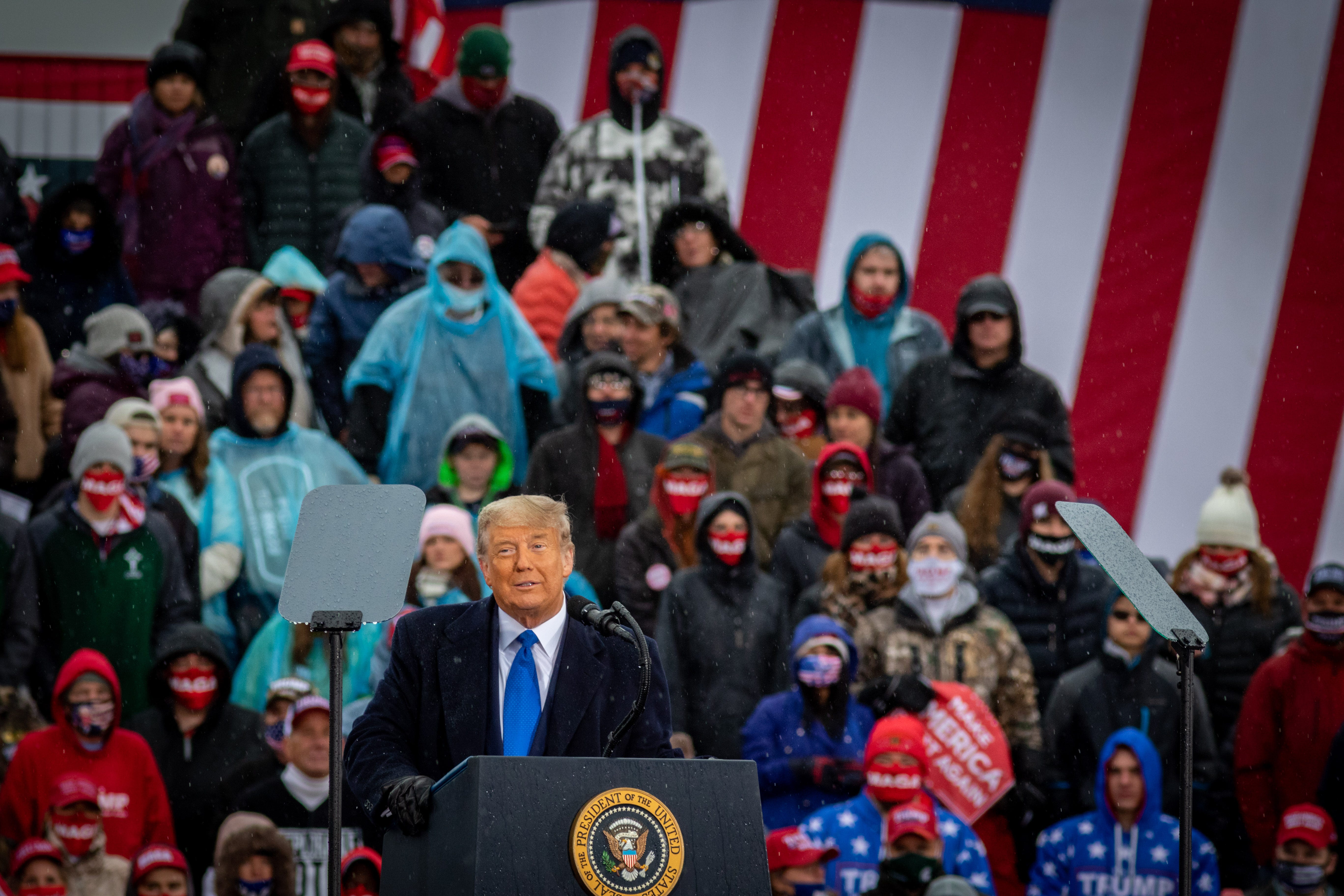 President Donald Trump addresses the crowd during a campaign rally in Lansing, Michigan on October 27, 2020, one week before the general election.